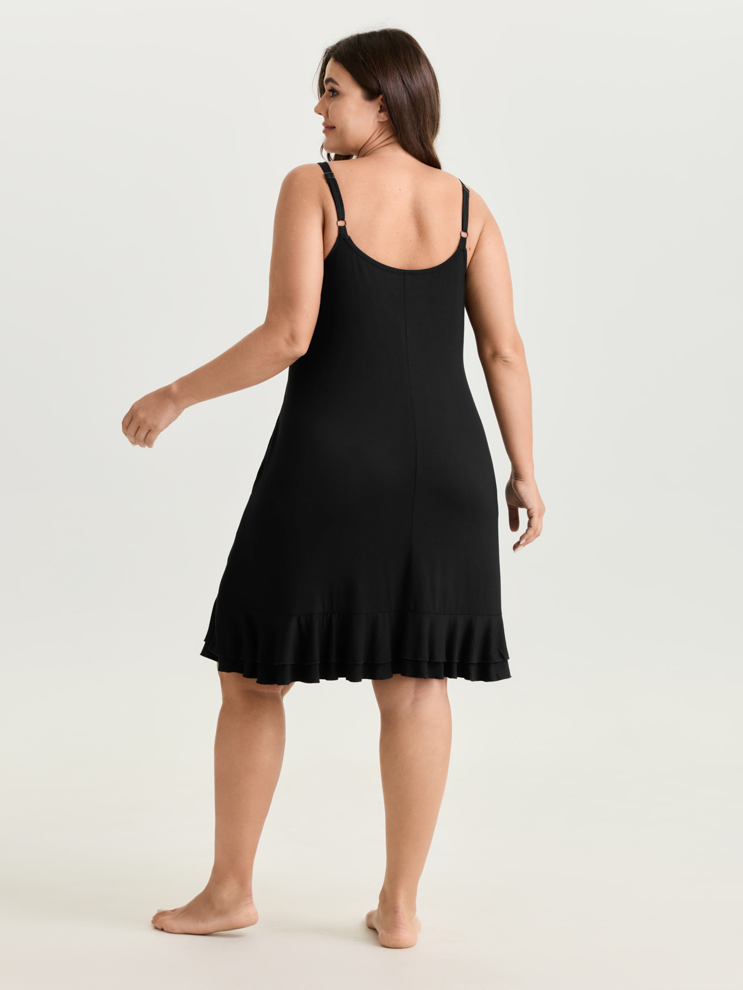 Side view of BloomChic Women's Plus Size Supersoft Stretchy Ruffled Neckline Lounge Dress Black not graphics Knee Length 28/5X