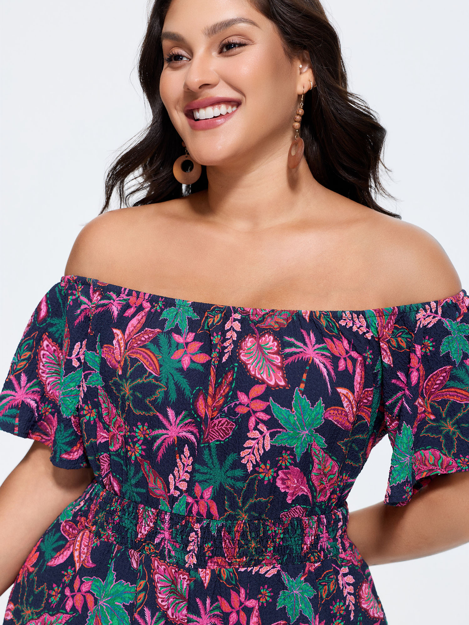 Side view of BloomChic Women's Plus Size Floral Print Ruffled Off-Shoulder Romper Multicolor Vacation 12/L