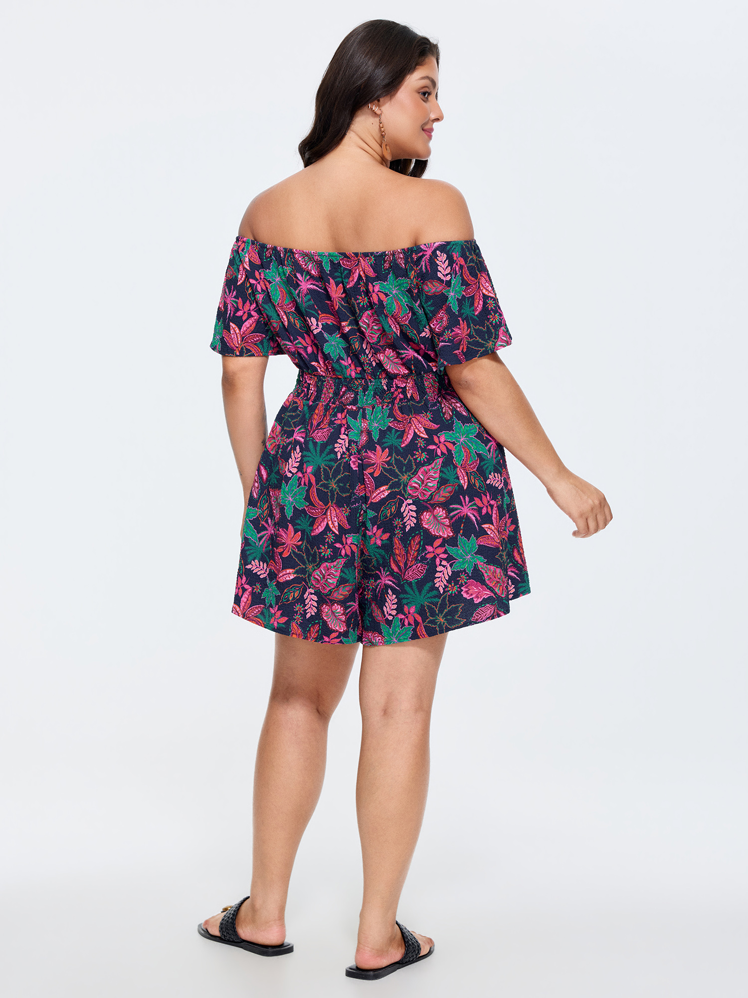 Side view of BloomChic Women's Plus Size Floral Print Ruffled Off-Shoulder Romper Multicolor Vacation 12/L