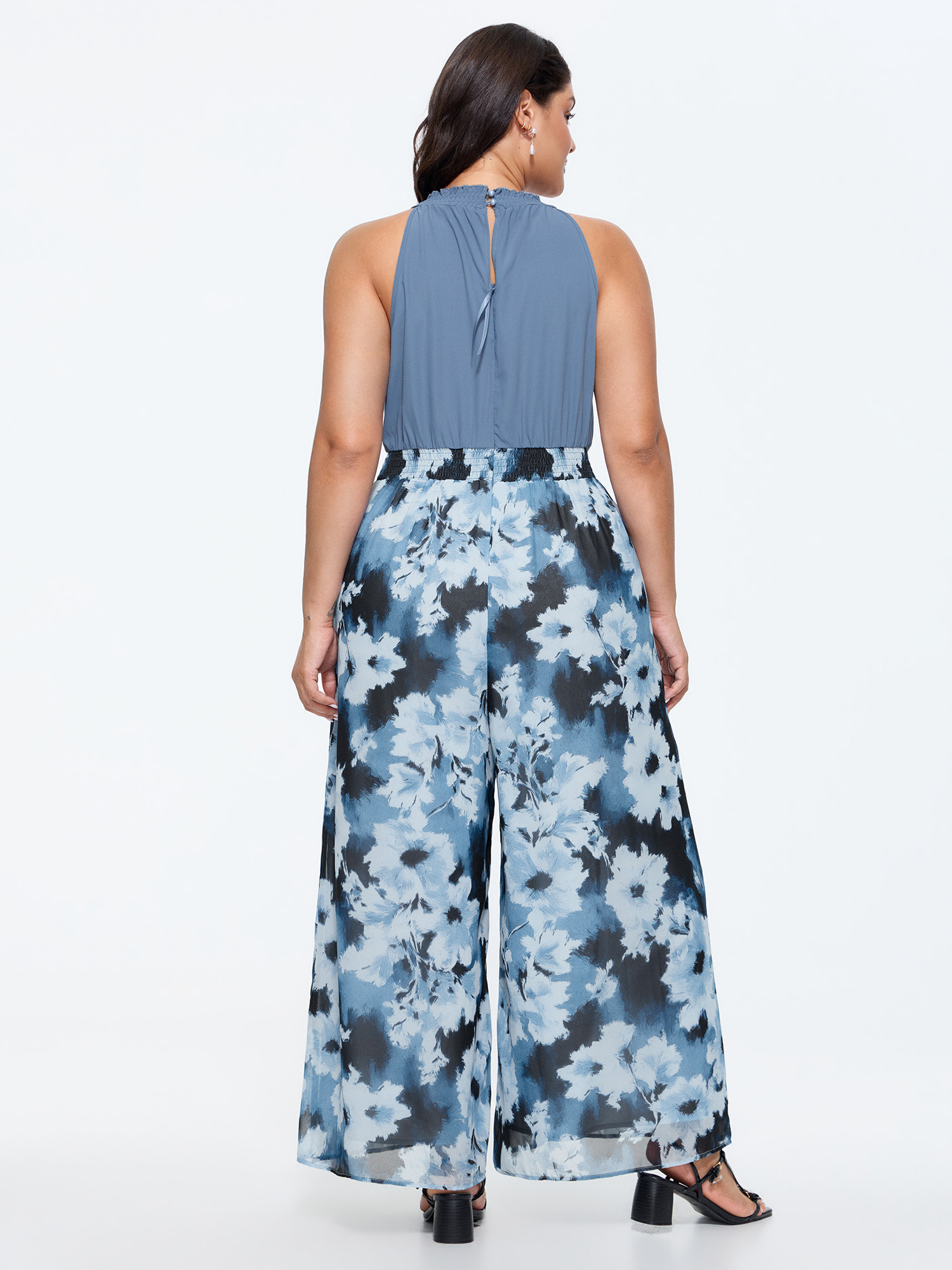 Side view of BloomChic Women's Plus Size Floral Print Color Contrast Jumpsuit DarkBlue Elegant Relaxed Fit 30/6X