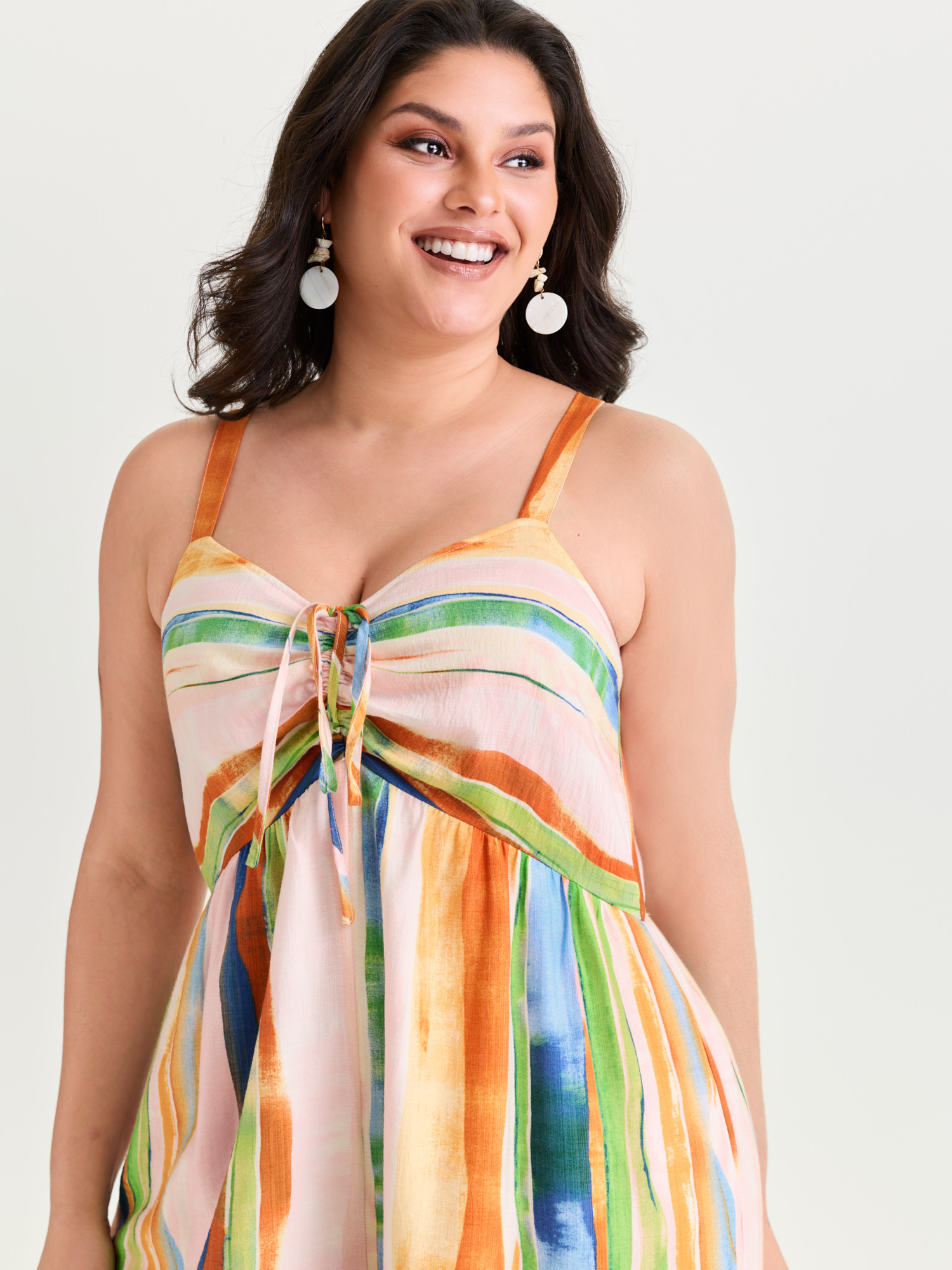 Side view of BloomChic Women's Plus Size Colorful Striped Print Ruched Jumpsuit Multicolor Vacation 18-20/2X