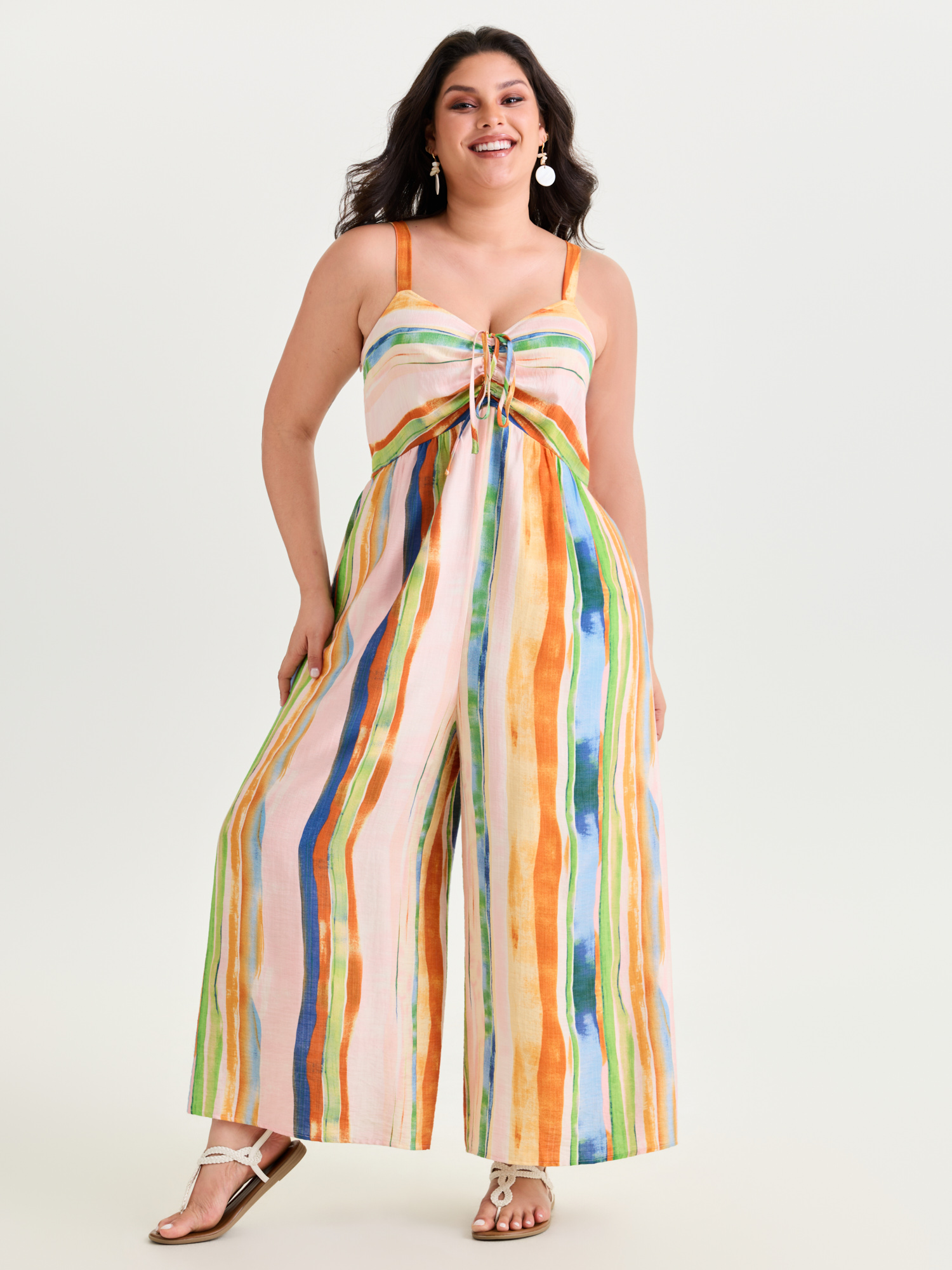 Side view of BloomChic Women's Plus Size Colorful Striped Print Ruched Jumpsuit Multicolor Vacation 18-20/2X