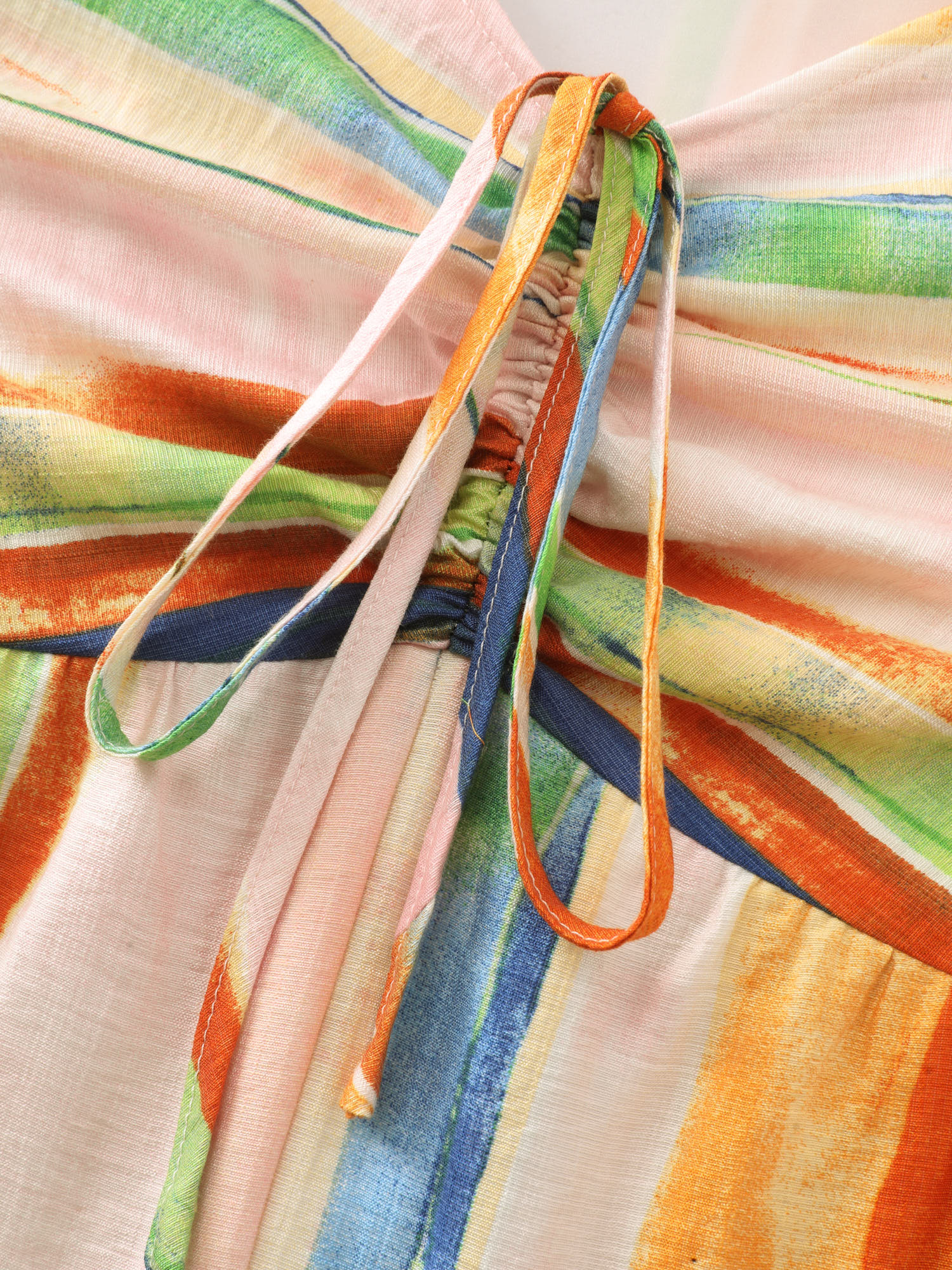 Side view of BloomChic Women's Plus Size Colorful Striped Print Ruched Jumpsuit Multicolor Vacation 18-20/2X
