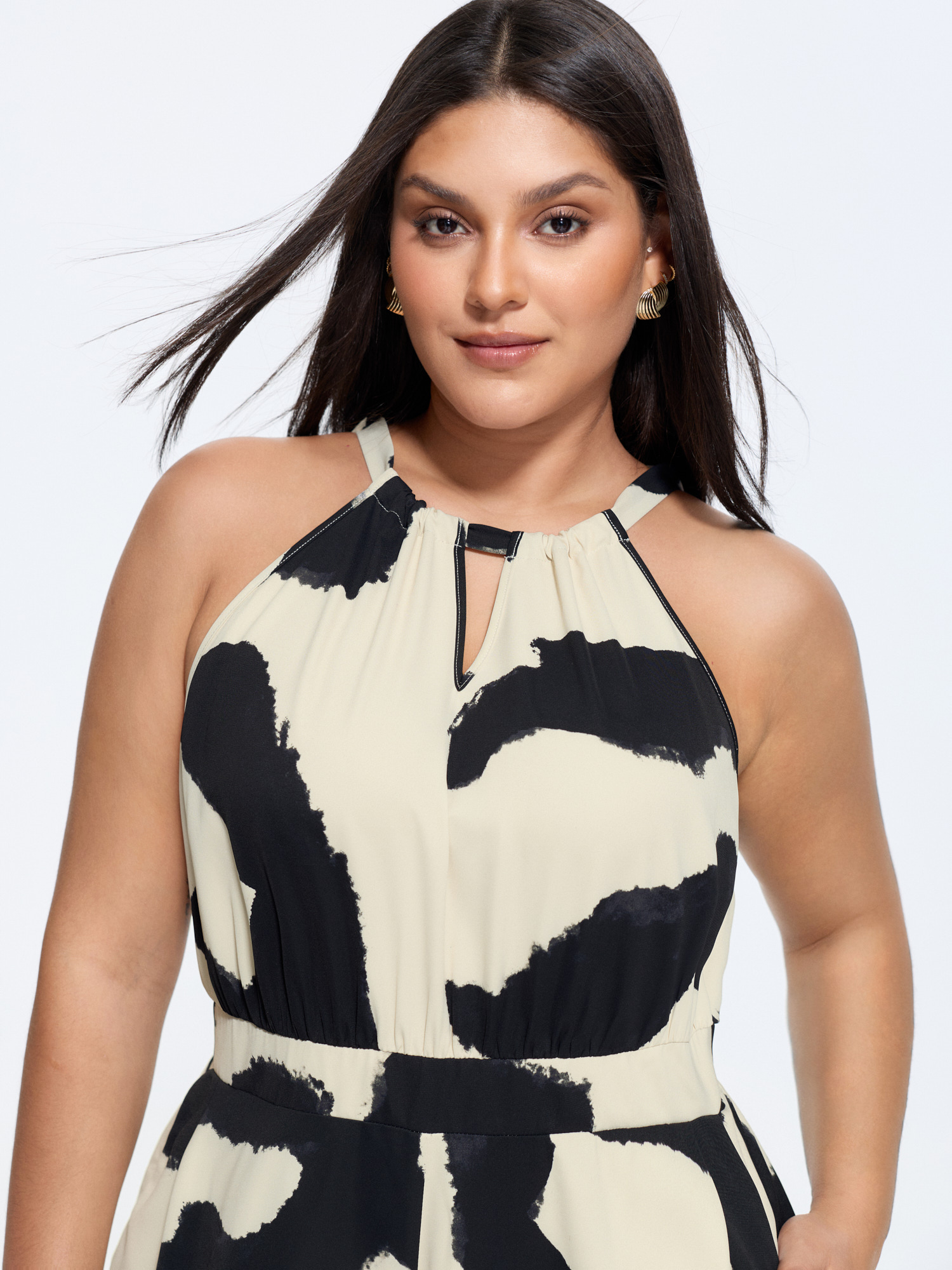 Side view of BloomChic Women's Plus Size Abstract Floral Print Halter Neckline Jumpsuit Beige Office Fitted 30/6X