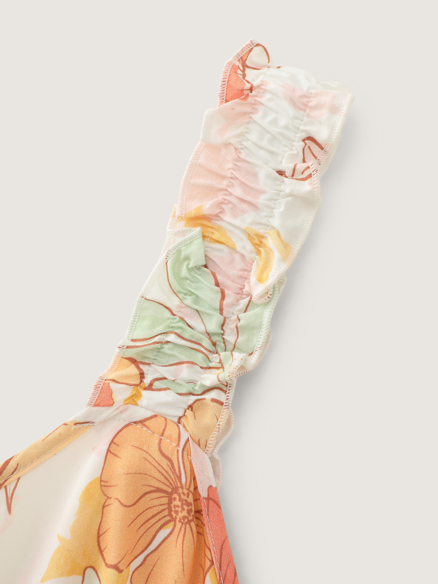 Side view of BloomChic Women's Plus Size Floral Print Bow-Tie Back Jumpsuit Multicolor Vacation 28/5X