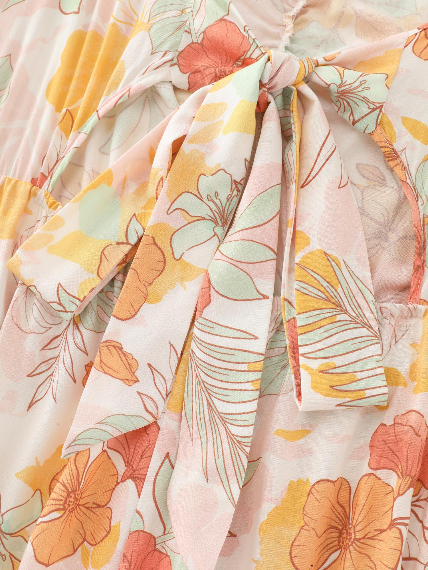 Side view of BloomChic Women's Plus Size Floral Print Bow-Tie Back Jumpsuit Multicolor Vacation 28/5X