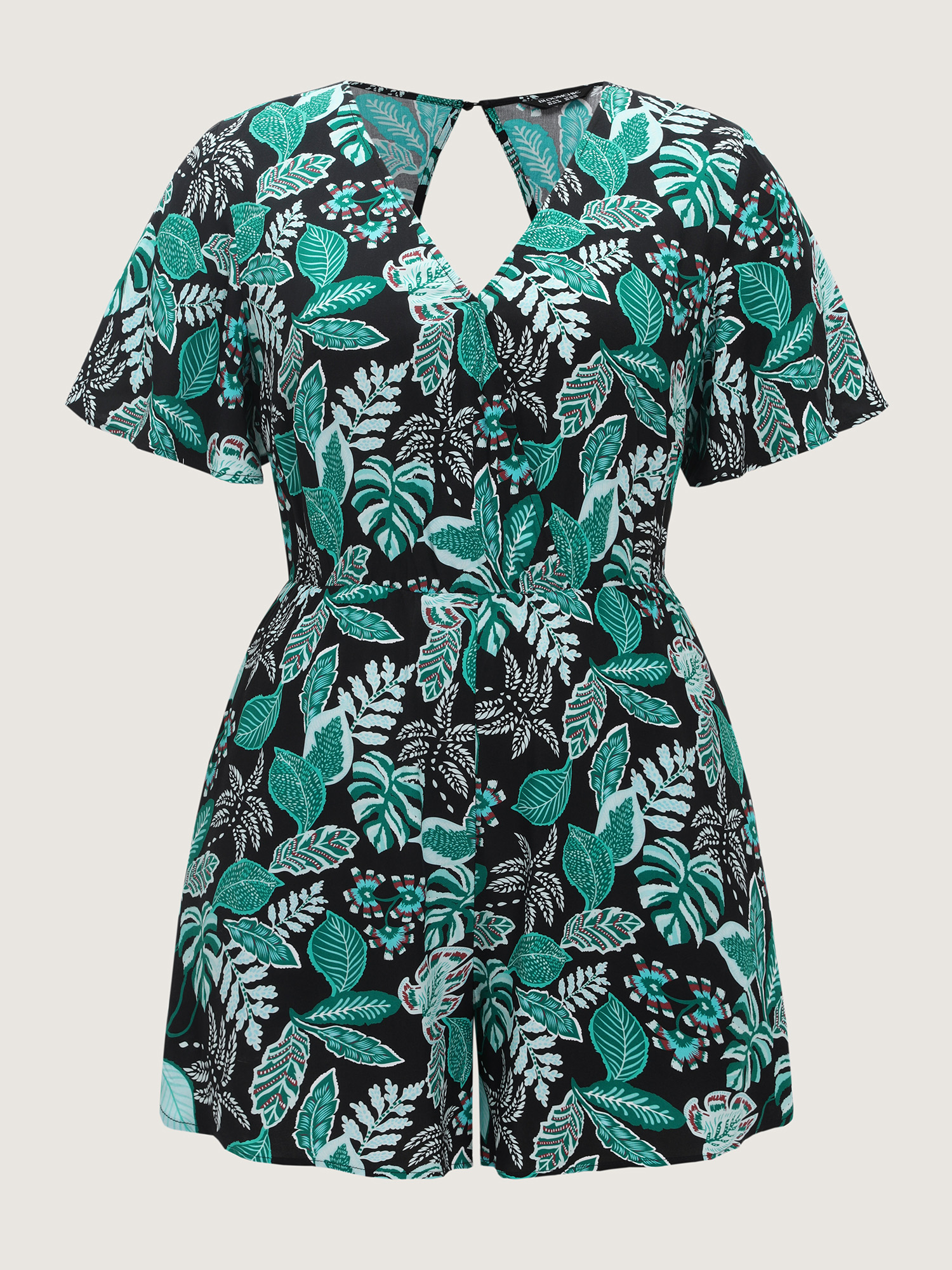 Side view of BloomChic Women's Plus Size Tropical Print Cut-Out Back Romper Black Vacation 14-16/1X