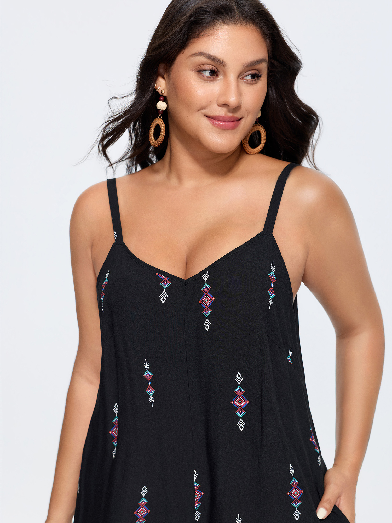 Side view of BloomChic Women's Plus Size Geometric Print Adjustable Backless Drawstring Jumpsuit Black Vacation 22-24/3X