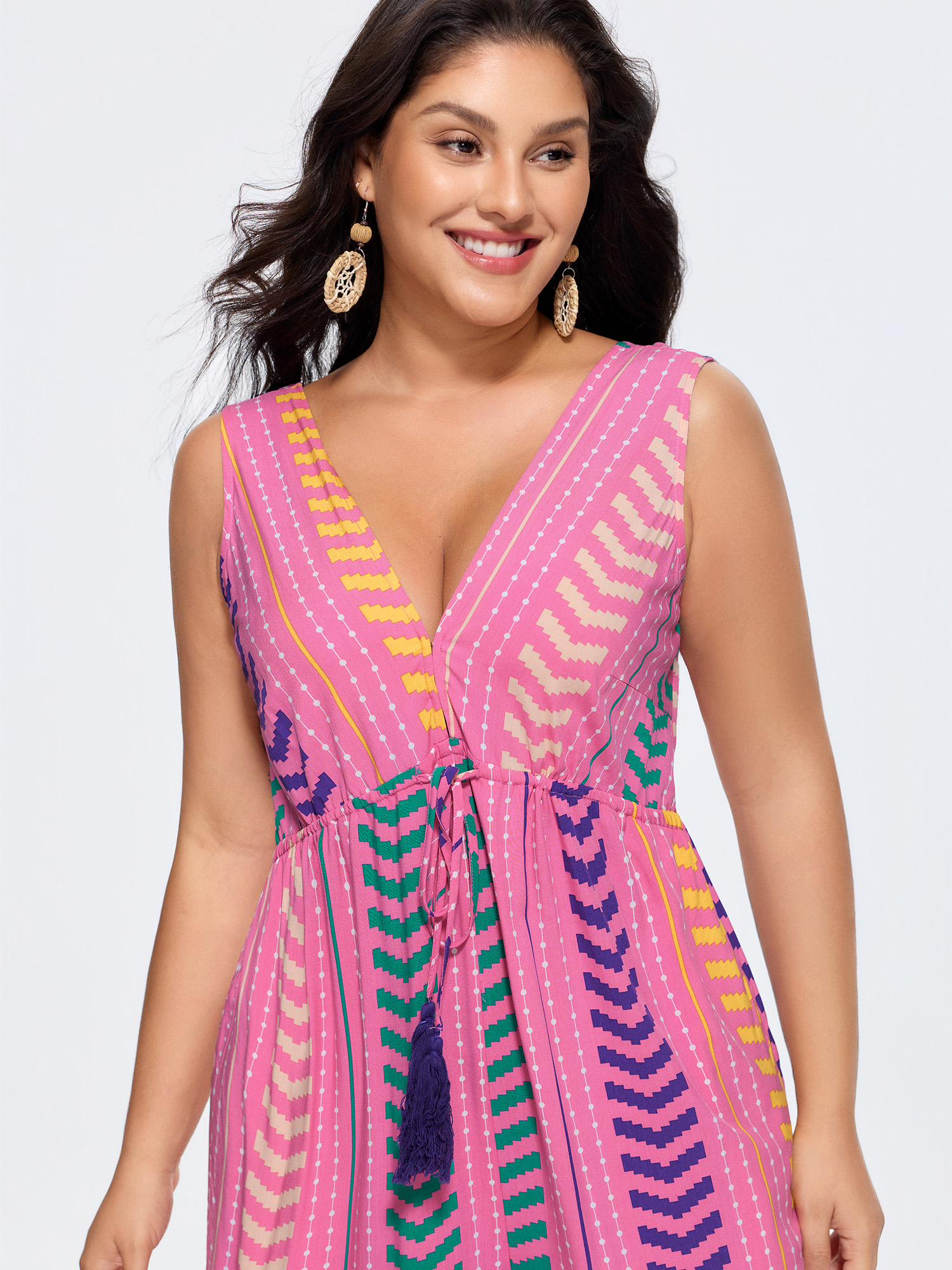 Side view of BloomChic Women's Plus Size Colorful Geometric Print Tassel Jumpsuit Peach Vacation 30/6X