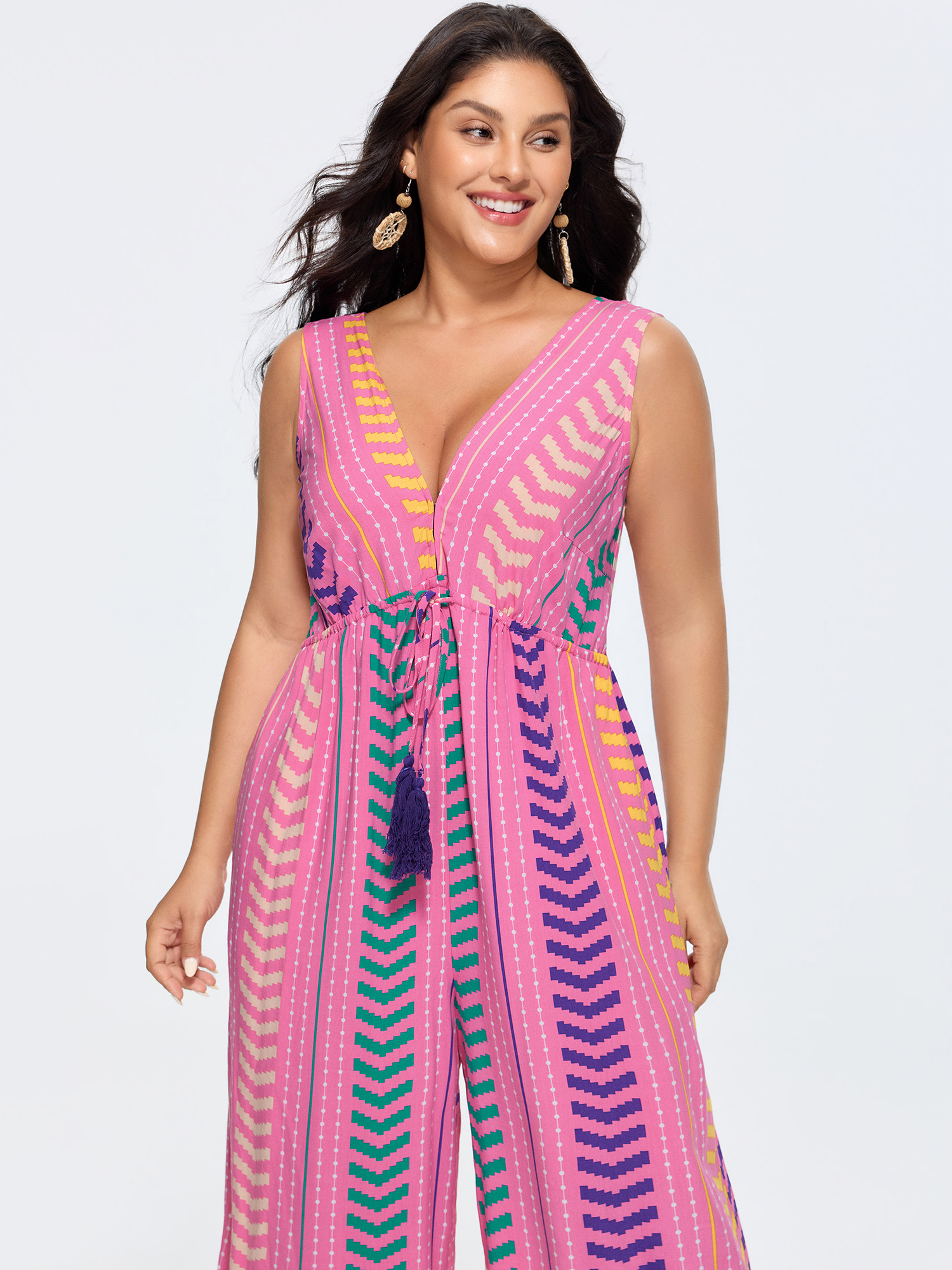 Side view of BloomChic Women's Plus Size Colorful Geometric Print Tassel Jumpsuit Peach Vacation 30/6X
