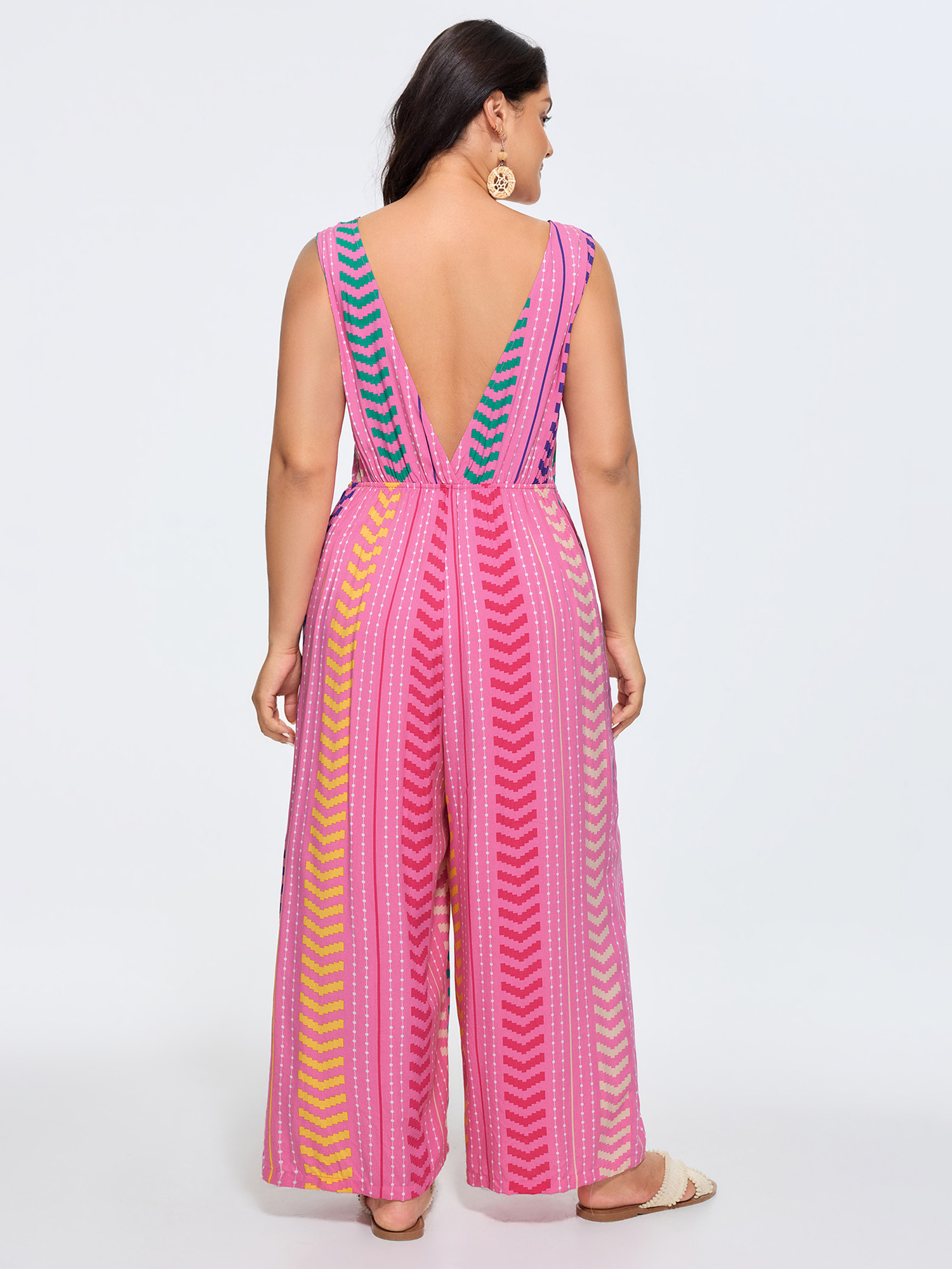 Side view of BloomChic Women's Plus Size Colorful Geometric Print Tassel Jumpsuit Peach Vacation 30/6X