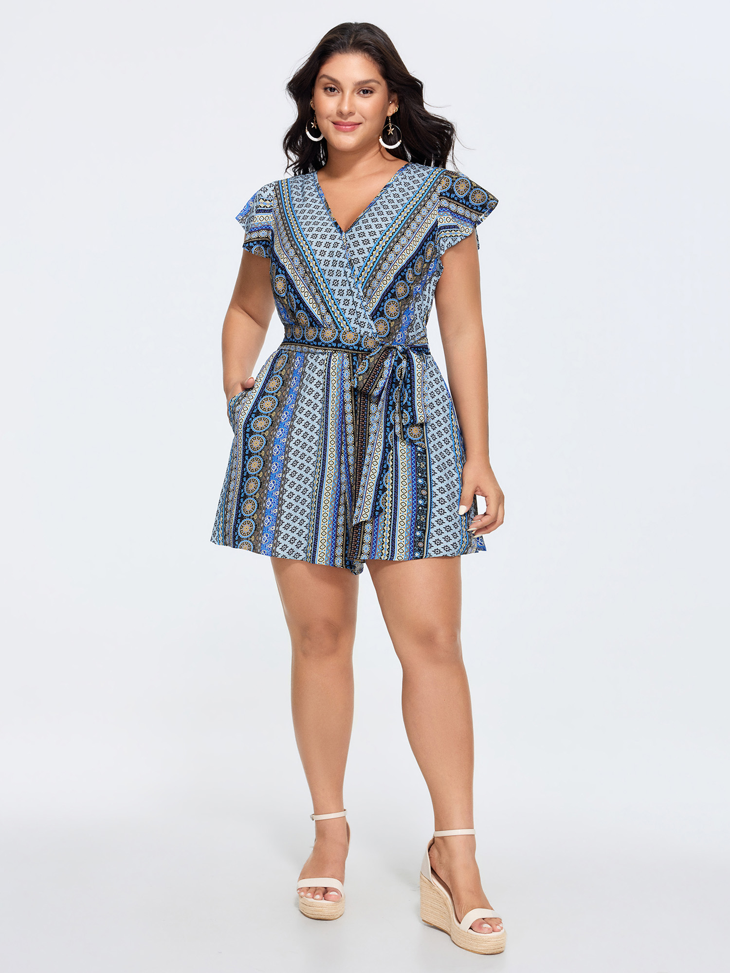 Side view of BloomChic Women's Plus Size Boho Striped Print Back-Tie Romper Multicolor Vacation 22-24/3X