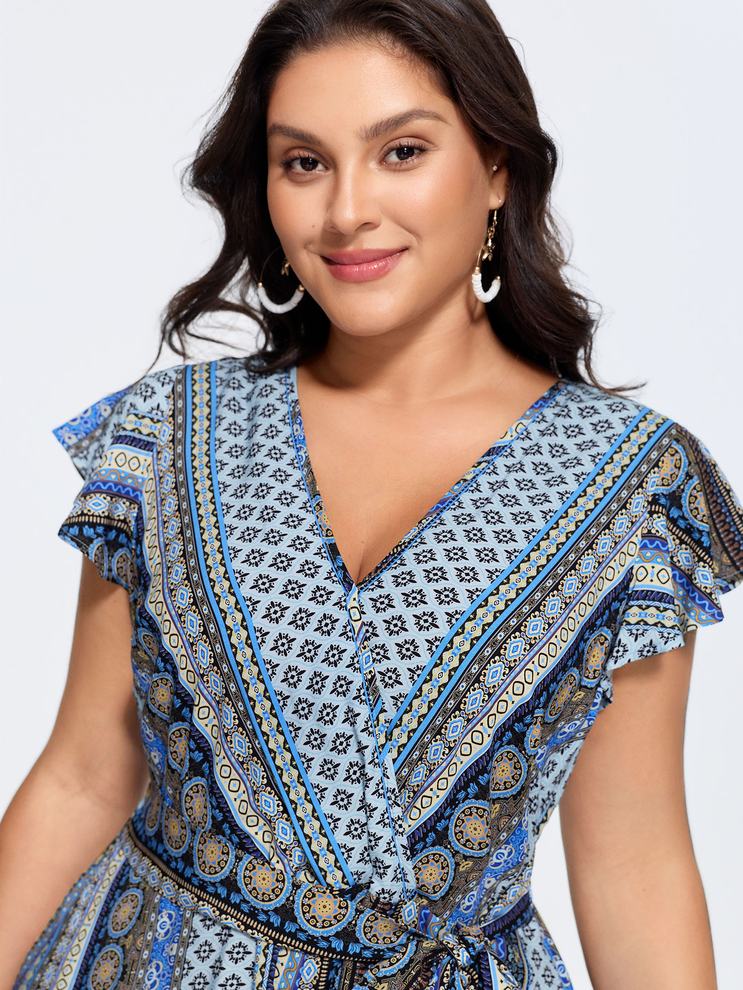 Side view of BloomChic Women's Plus Size Boho Striped Print Back-Tie Romper Multicolor Vacation 22-24/3X