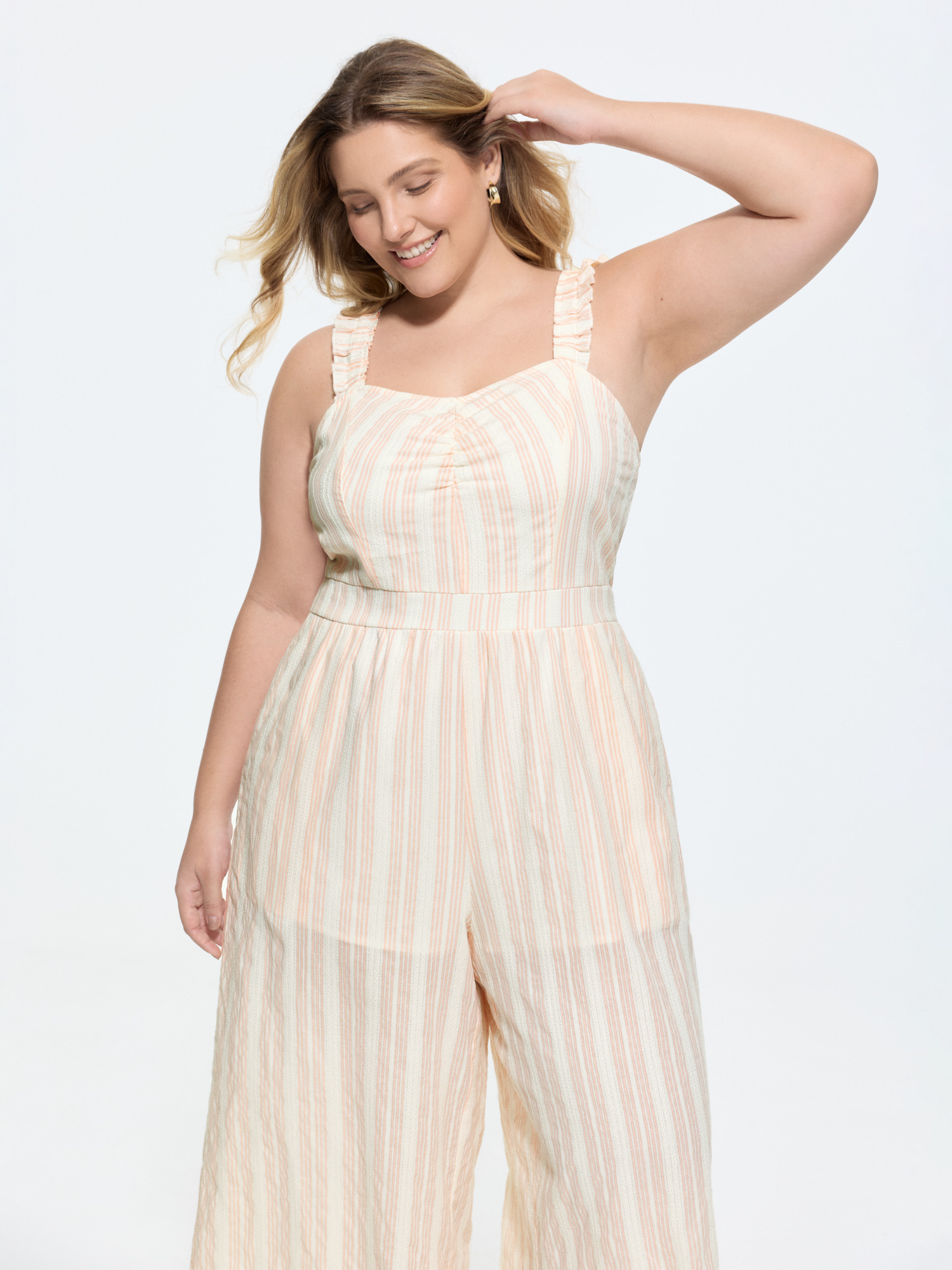 Side view of BloomChic Women's Plus Size Sheer Striped Print Shirred Straps Jumpsuit MistyRose Casual 12/L