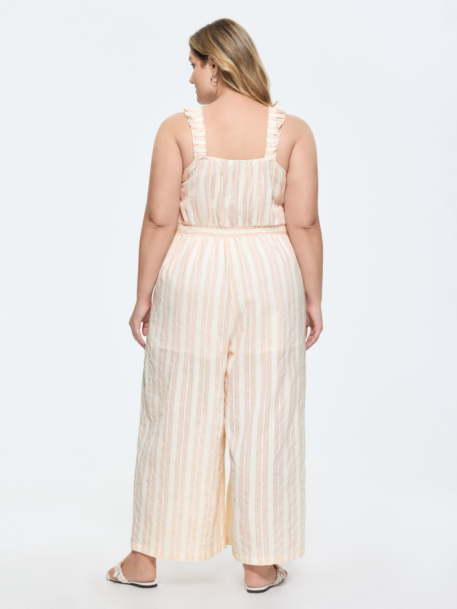 Side view of BloomChic Women's Plus Size Sheer Striped Print Shirred Straps Jumpsuit MistyRose Casual 12/L