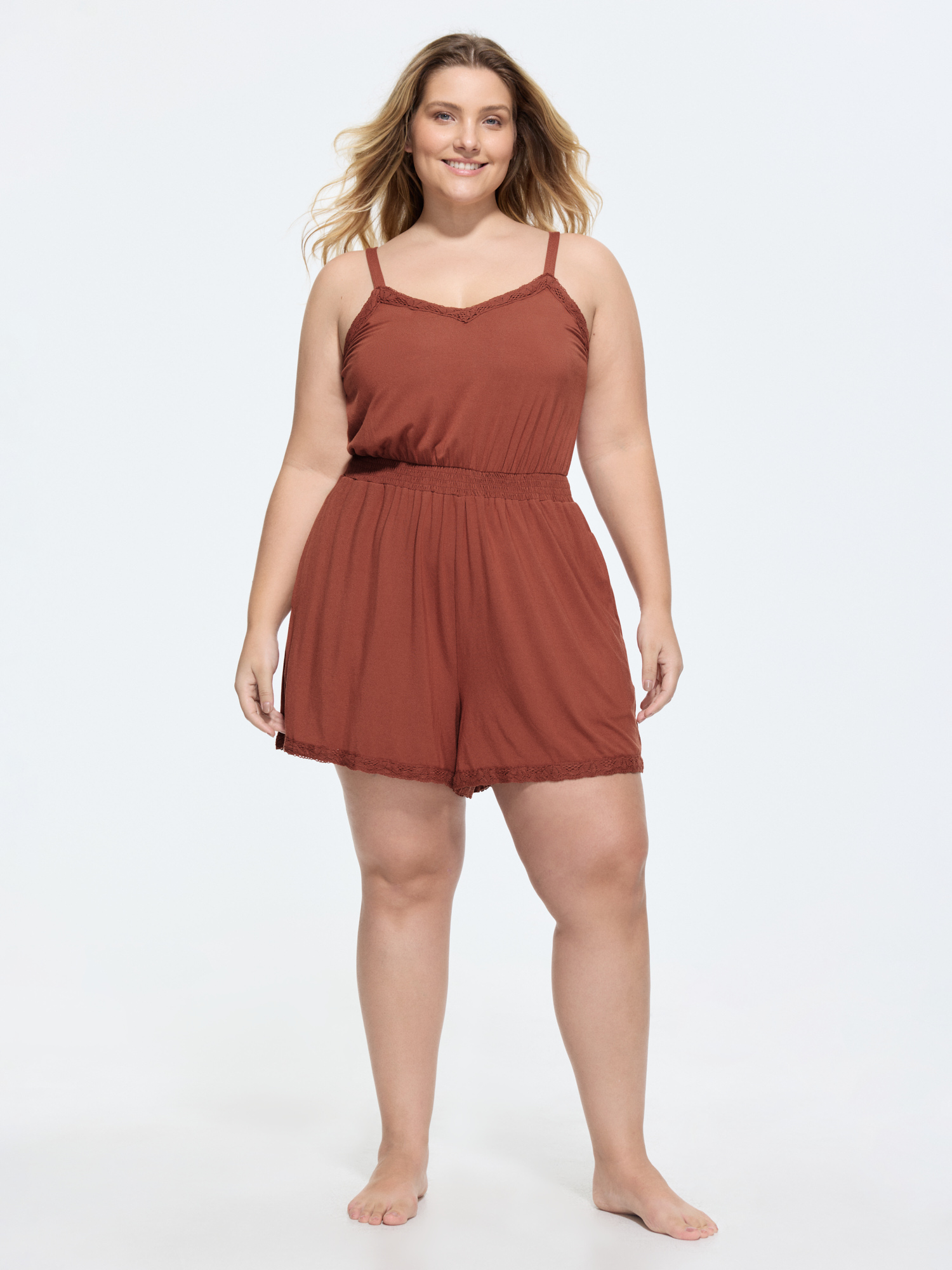 Side view of BloomChic Women's Plus Size Supersoft Lace Detail Lounge Romper Rust not graphics short 14-16/1X