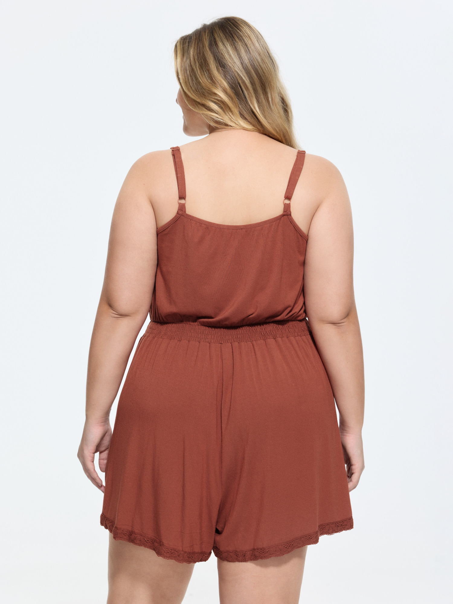 Side view of BloomChic Women's Plus Size Supersoft Lace Detail Lounge Romper Rust not graphics short 14-16/1X