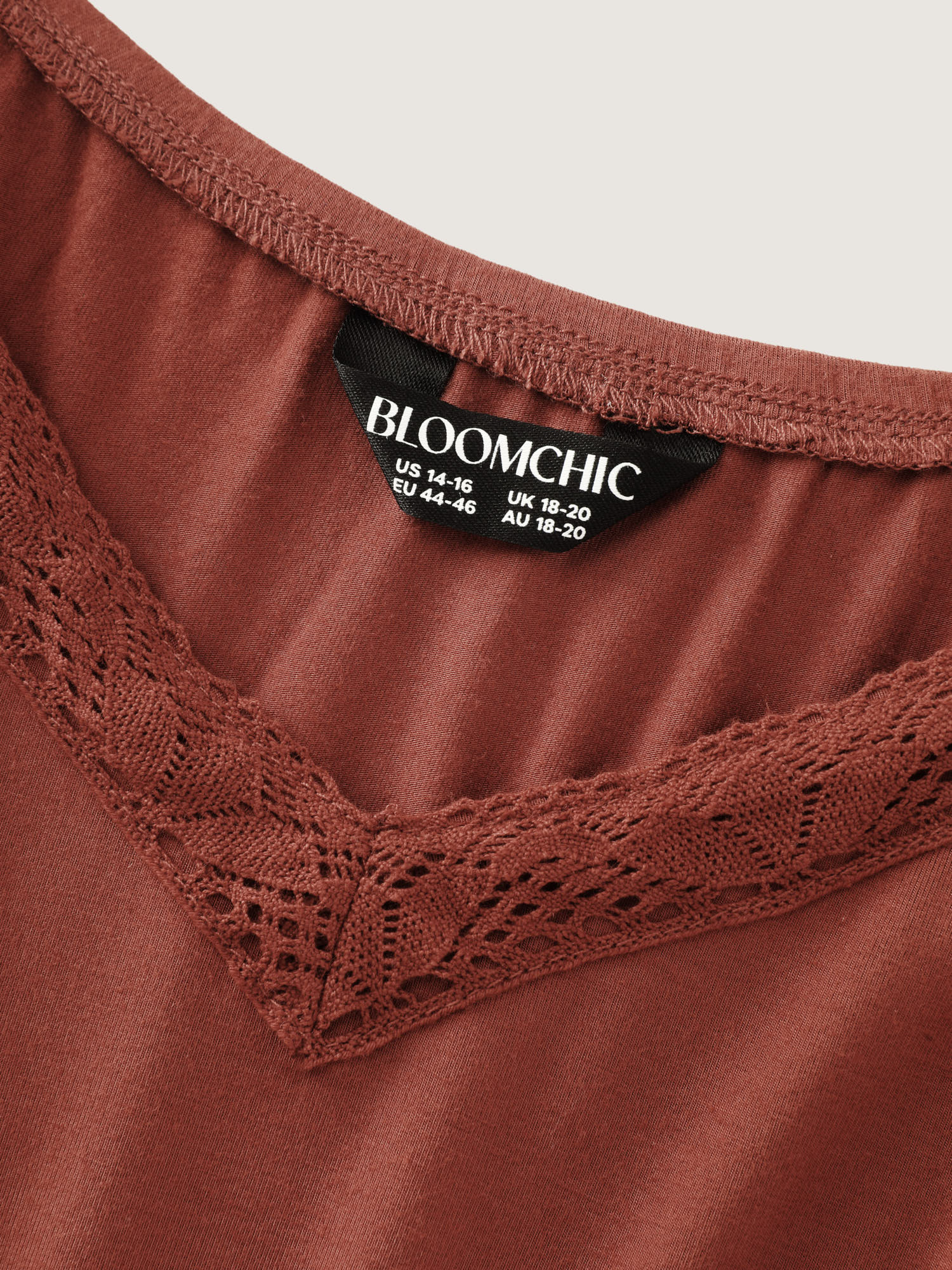 Side view of BloomChic Women's Plus Size Supersoft Lace Detail Lounge Romper Rust not graphics short 14-16/1X