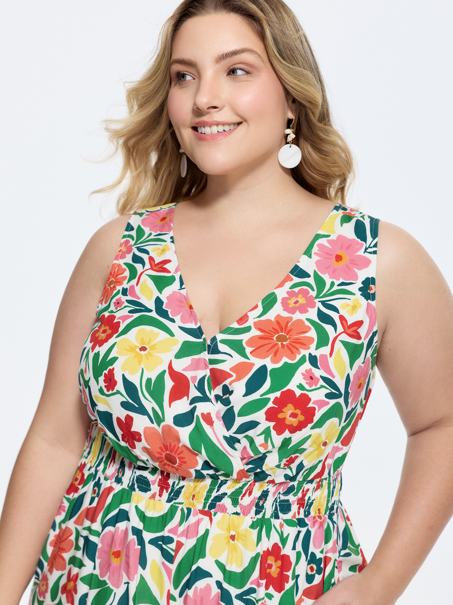 Side view of BloomChic Women's Plus Size Vibrant Floral Print Shirred Waist Jumpsuit Multicolor Vacation Relaxed Fit 26/4X