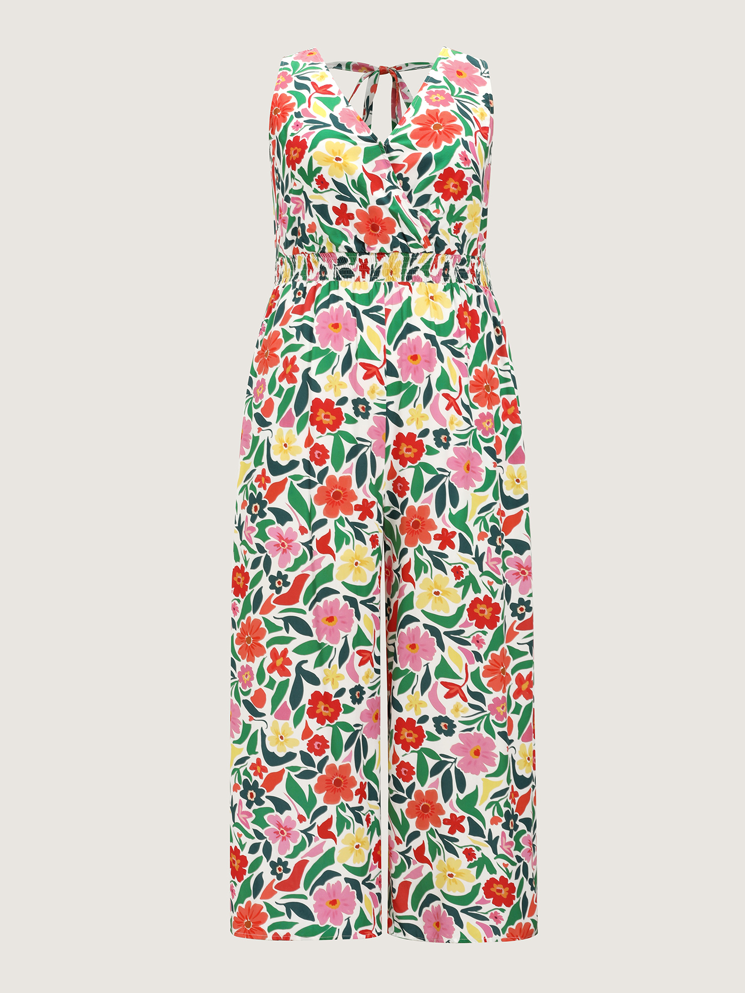 Side view of BloomChic Women's Plus Size Vibrant Floral Print Shirred Waist Jumpsuit Multicolor Vacation Relaxed Fit 26/4X