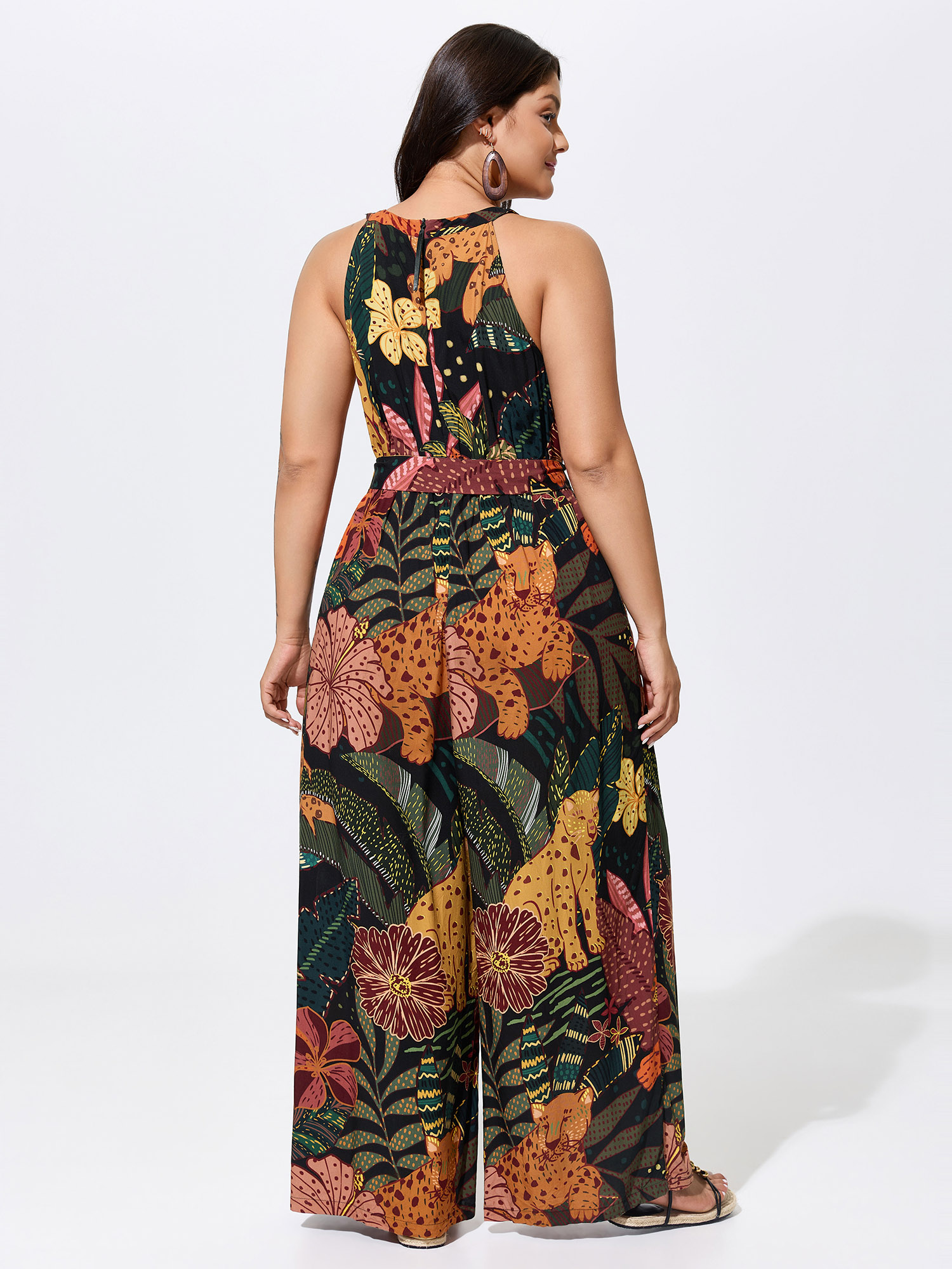 Side view of BloomChic Women's Plus Size Wild Print Halter Neckline Sleeveless Jumpsuit Multicolor Vacation 22-24/3X