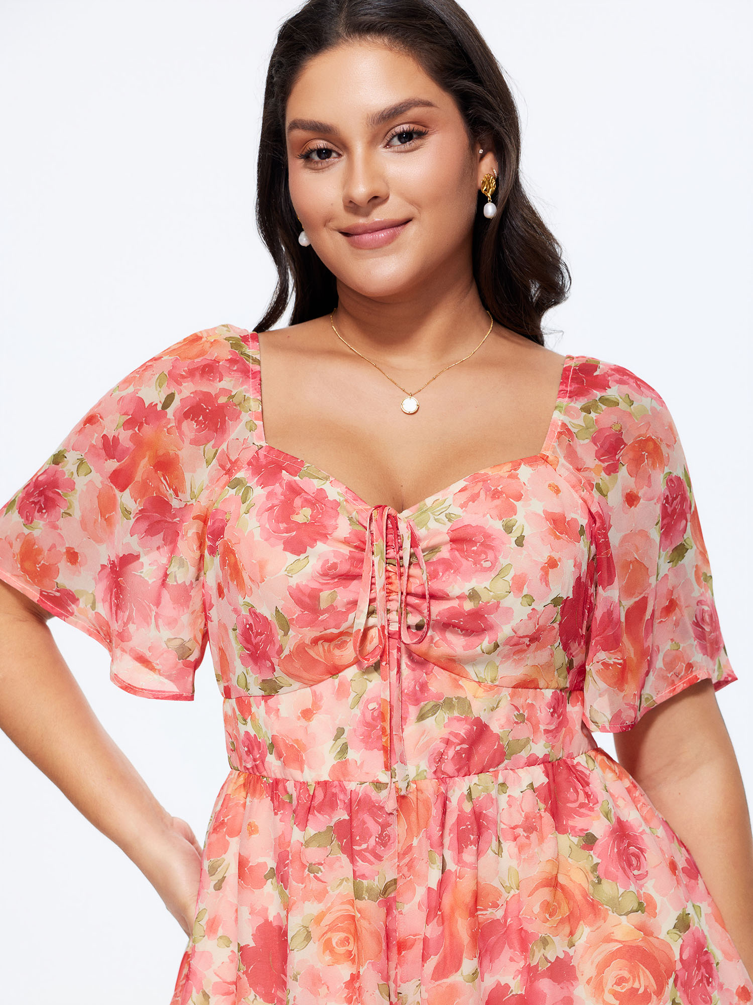 Side view of BloomChic Women's Plus Size Floral Print Ruched Bodice Romper Beanpastepowder Elegant Fitted 12/L