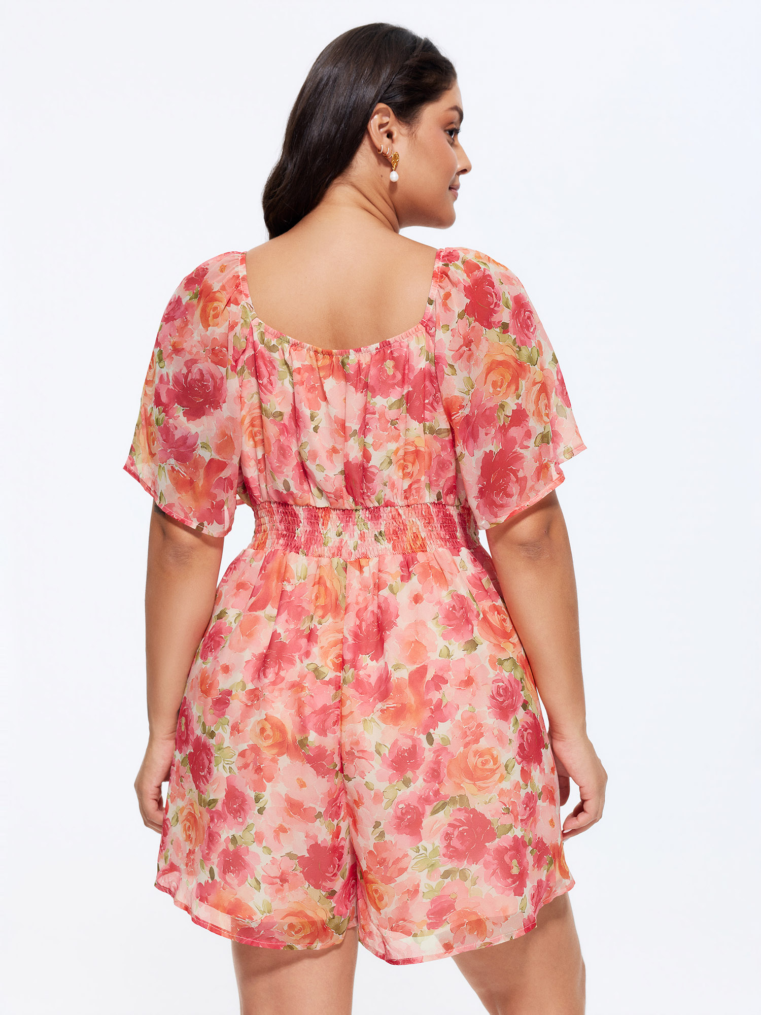Side view of BloomChic Women's Plus Size Floral Print Ruched Bodice Romper Beanpastepowder Elegant Fitted 12/L