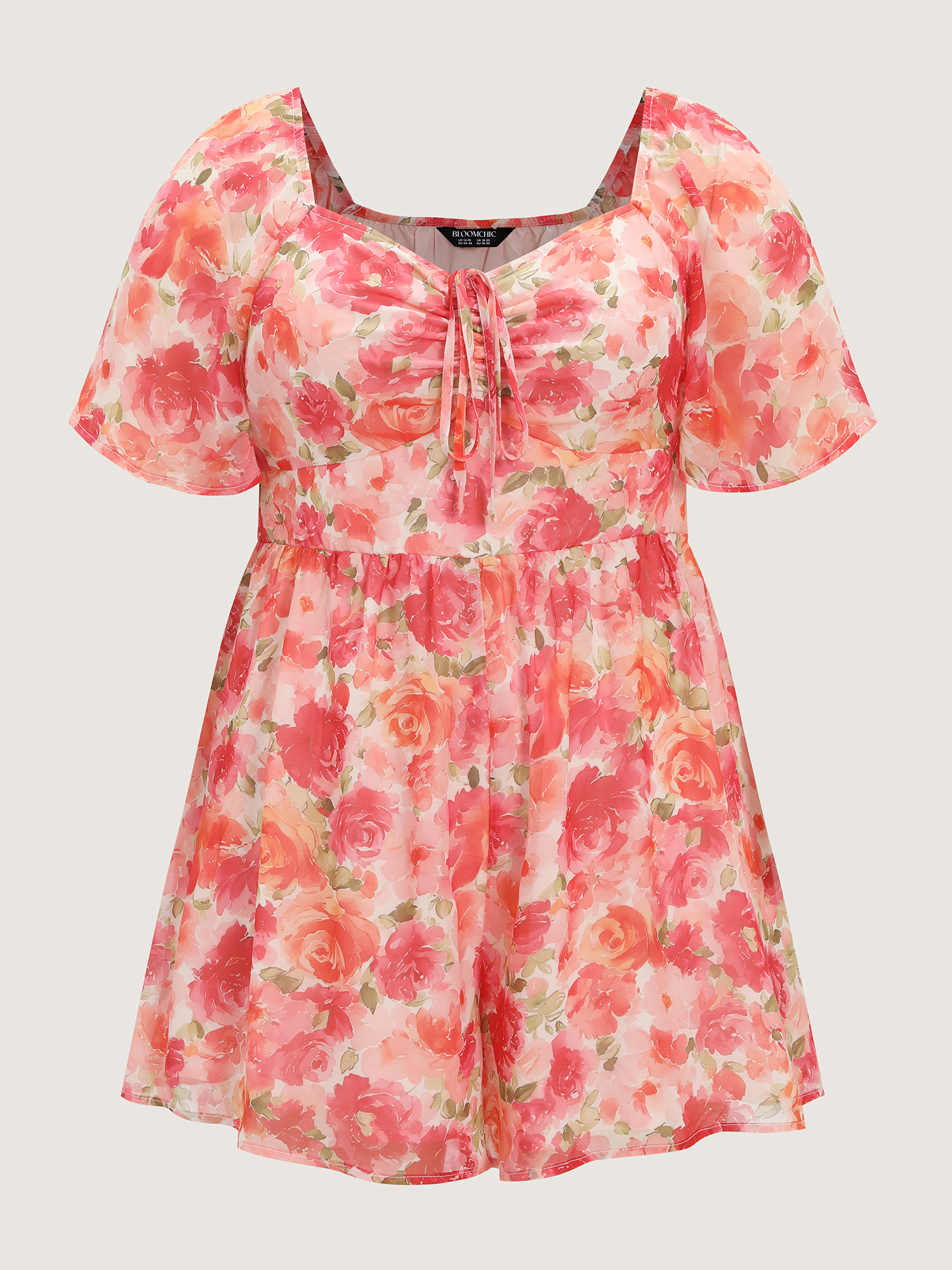Side view of BloomChic Women's Plus Size Floral Print Ruched Bodice Romper Beanpastepowder Elegant Fitted 12/L