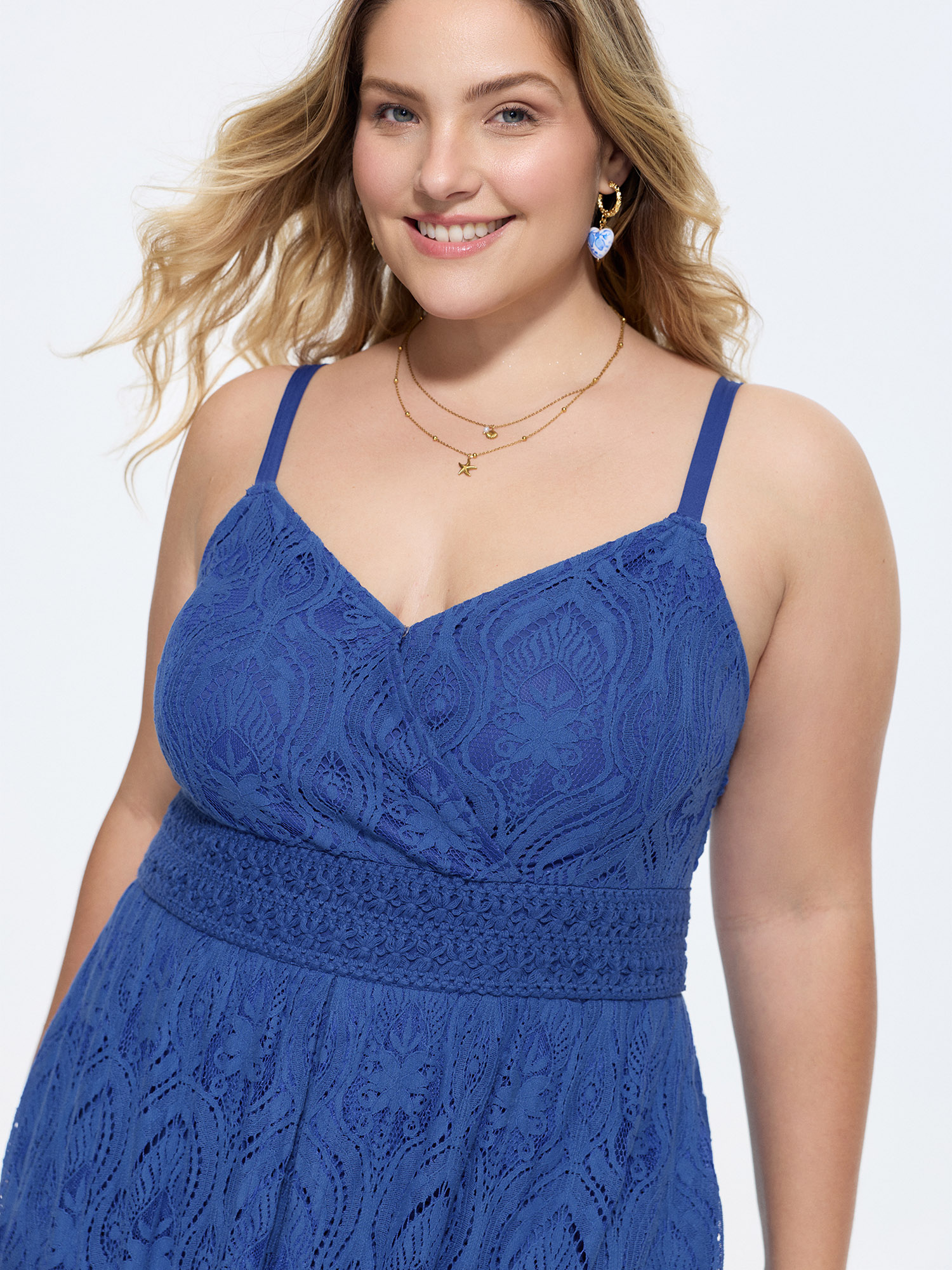 Side view of BloomChic Women's Plus Size Lace Textured Shirred Flowy Romper Navy Vacation 22-24/3X