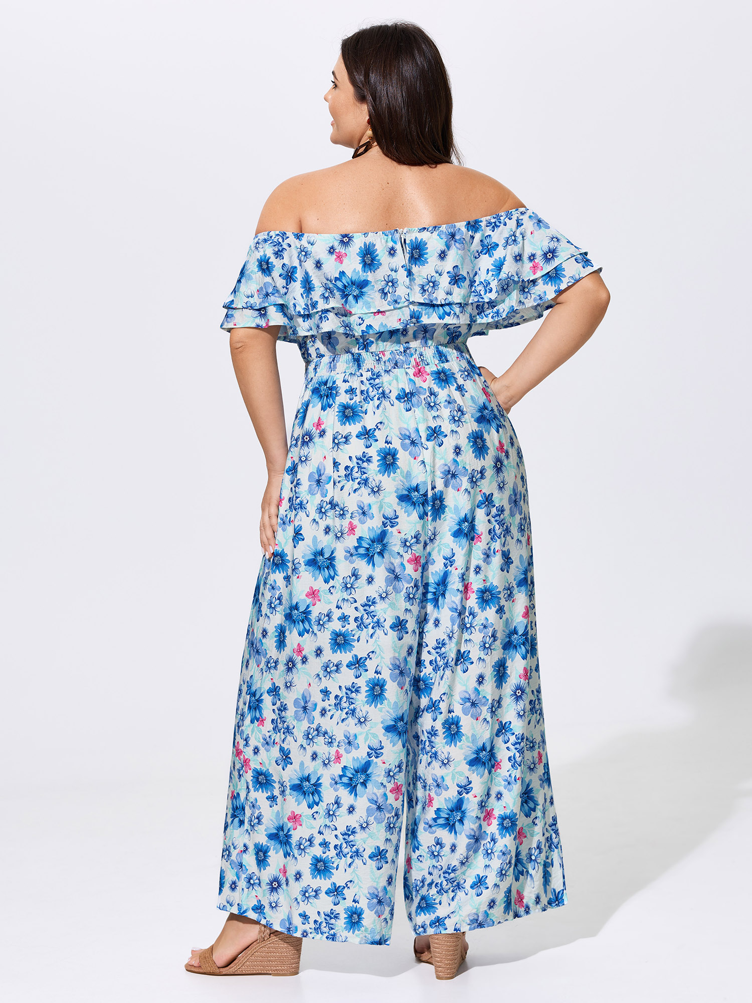 Side view of BloomChic Women's Plus Size Supersoft Floral Print Off-Shoulder Breezy Jumpsuit Skyblue Vacation 22-24/3X