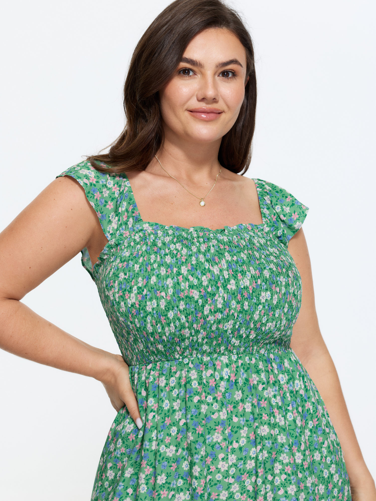 Side view of BloomChic Women's Plus Size Floral Print Ruffled Straps Jumpsuit Greenbean Elegant 18-20/2X