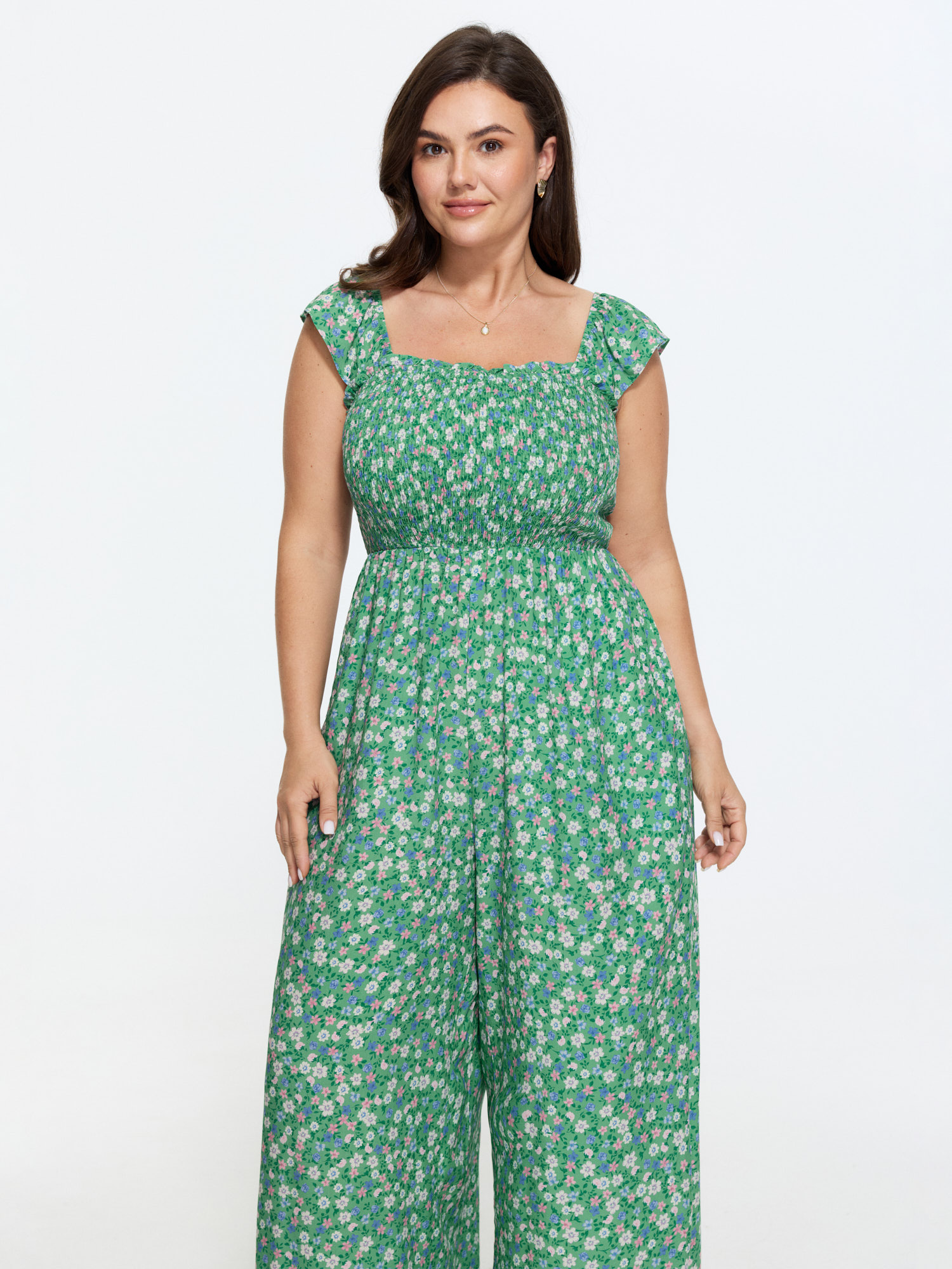 Side view of BloomChic Women's Plus Size Floral Print Ruffled Straps Jumpsuit Greenbean Elegant 18-20/2X