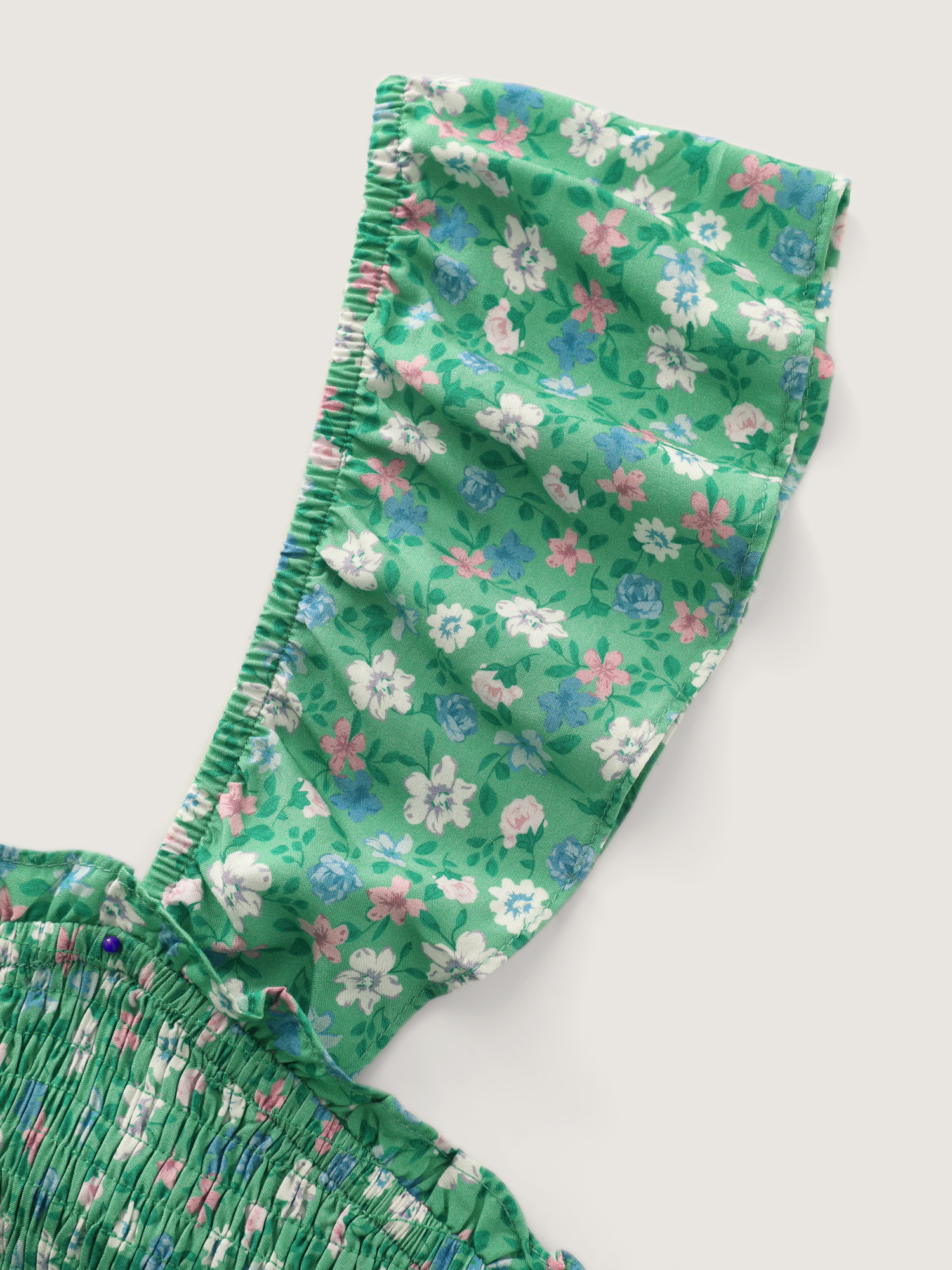 Side view of BloomChic Women's Plus Size Floral Print Ruffled Straps Jumpsuit Greenbean Elegant 18-20/2X