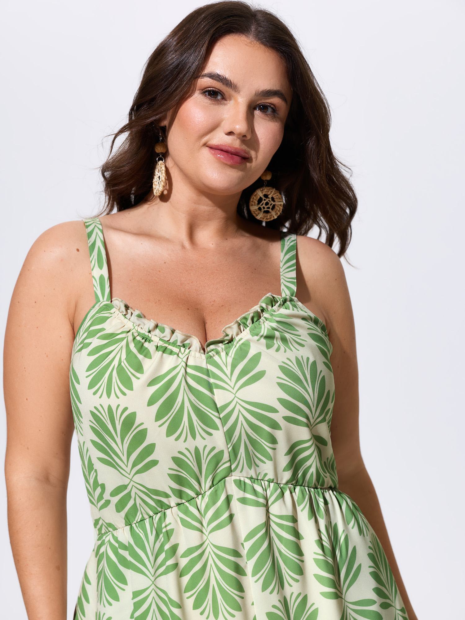 Side view of BloomChic Women's Plus Size Silhouette Floral Print Sweetheart Jumpsuit LightGreen Vacation 12/L