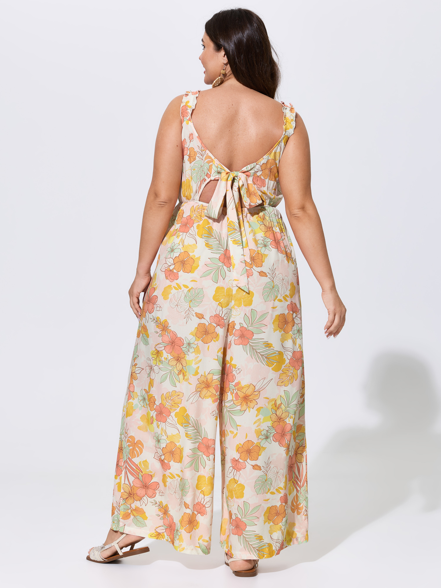 Side view of BloomChic Women's Plus Size Floral Print Bow-Tie Back Jumpsuit Multicolor Vacation 28/5X