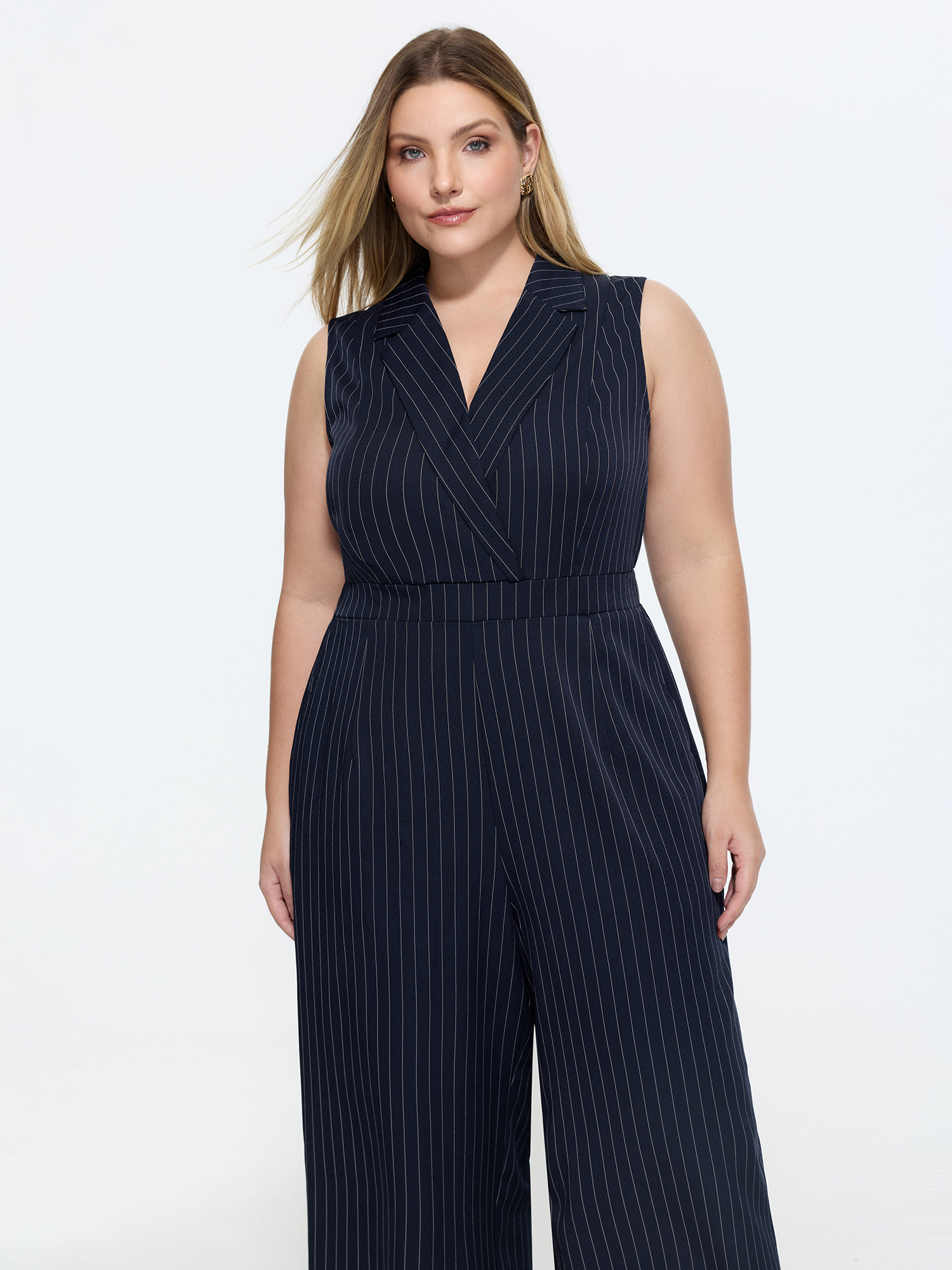 Side view of BloomChic Women's Plus Size Striped Print Collared Sleeveless Jumpsuit Indigo Office Fitted 12/L