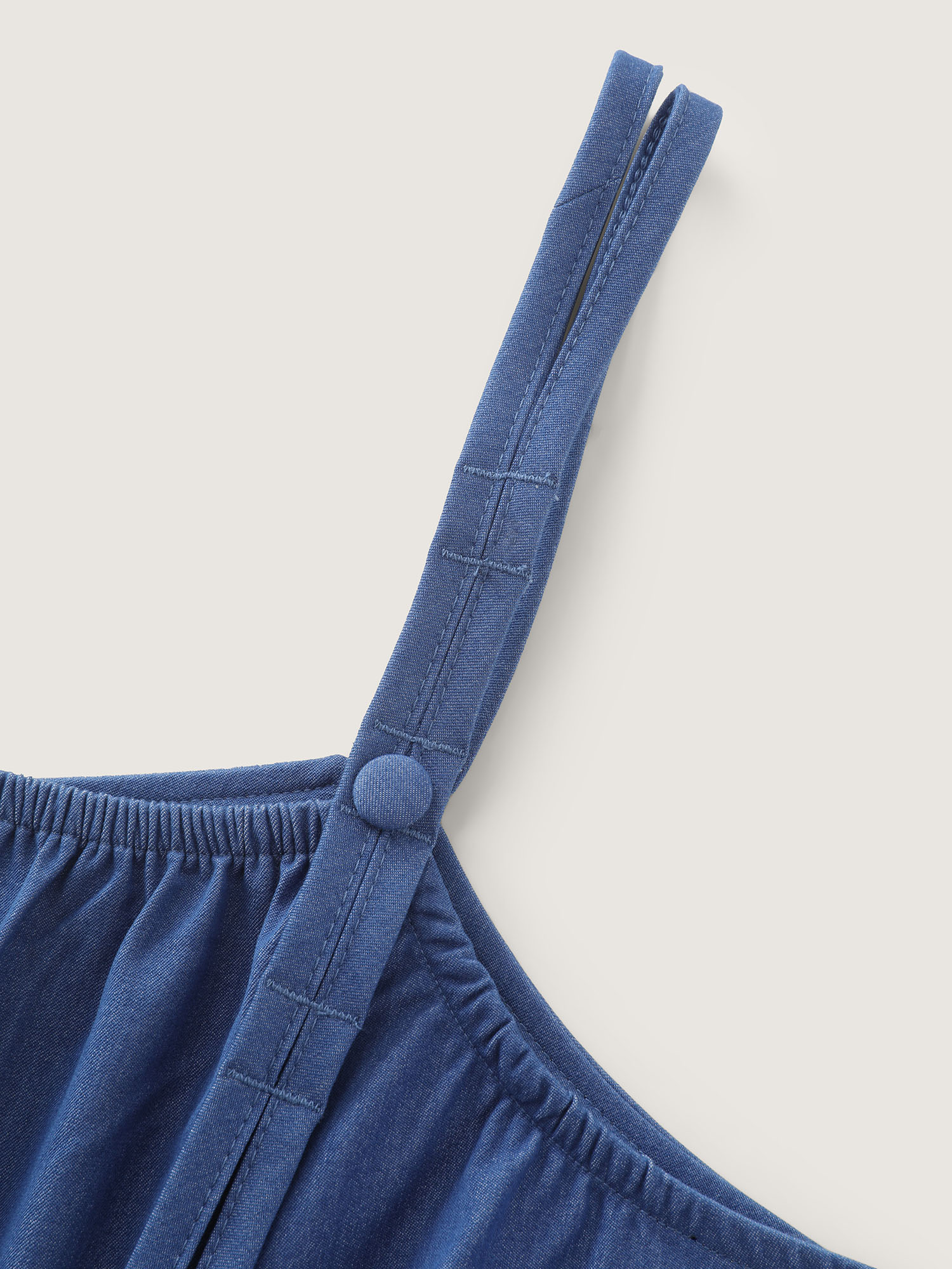 Side view of BloomChic Women's Plus Size Supersoft Pleated Sleeveless Faux Denim Jumpsuit Mediumblue Casual 10/M