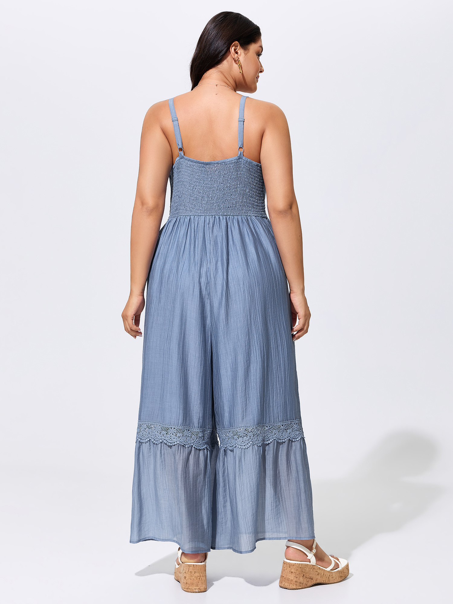 Side view of BloomChic Women's Plus Size Shirred Lace Detail Wide-Leg Jumpsuit Stone Vacation Fitted 26/4X