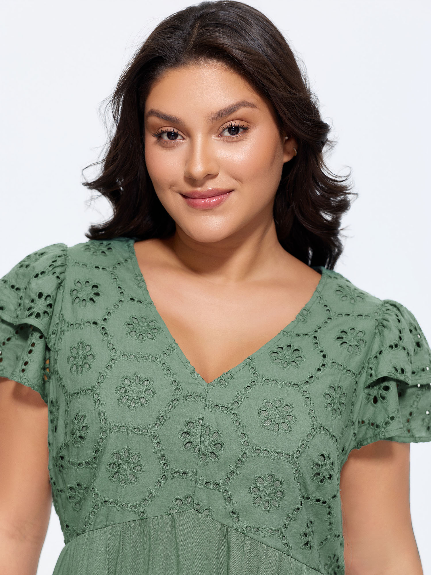 Side view of BloomChic Women's Plus Size Eyelet Trim Layered Sleeve Romper Greenbean Casual 18-20/2X