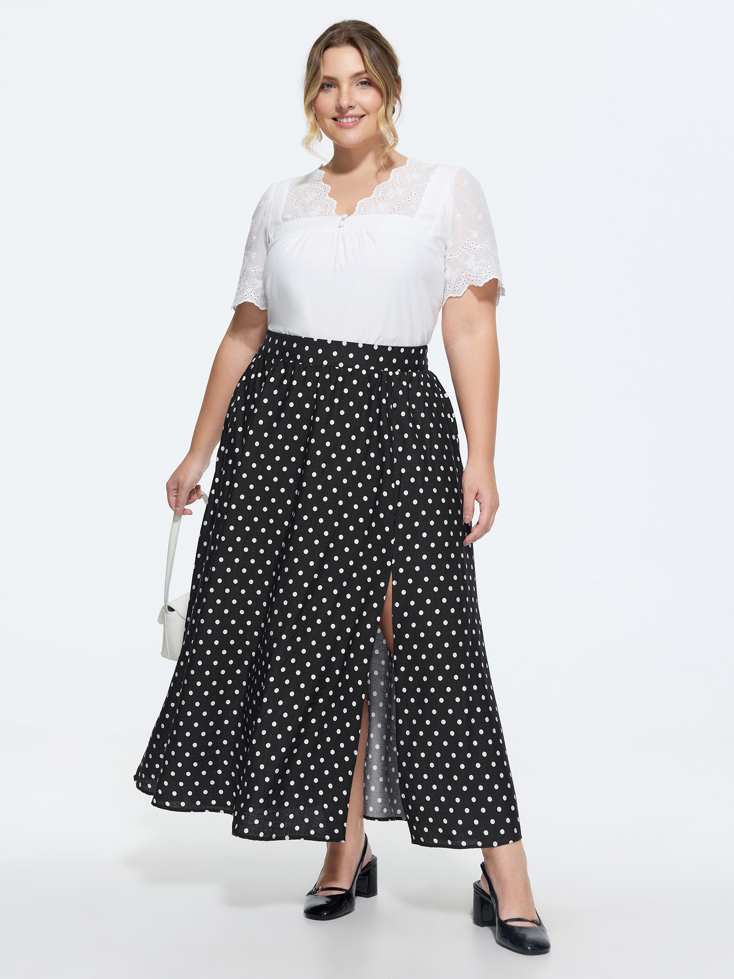 Side view of BloomChic Women's Plus Size Polka Dots Charm Maxi Skirt Black Non Flared Elegant 30/6X