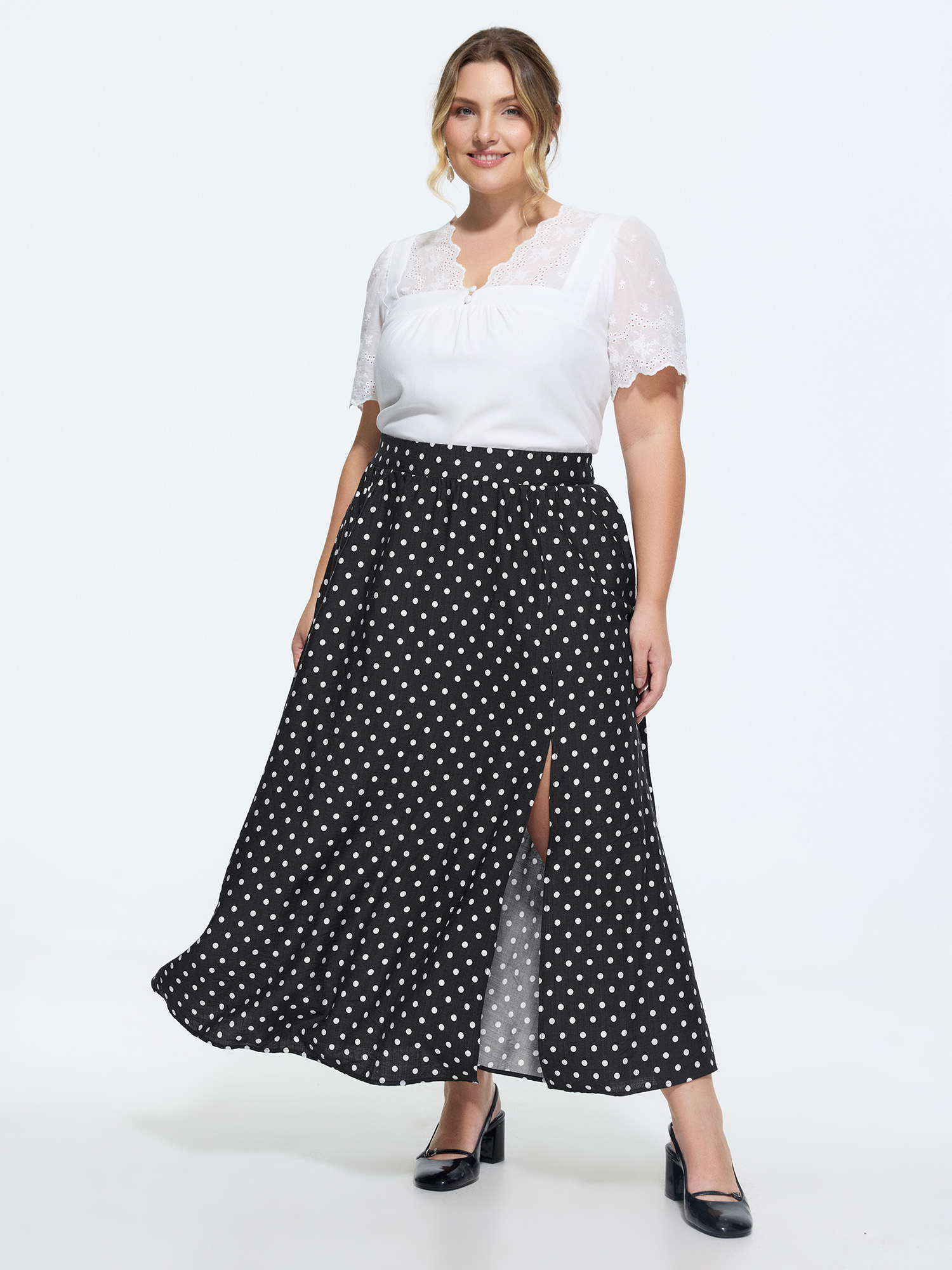 Side view of BloomChic Women's Plus Size Polka Dots Charm Maxi Skirt Black Non Flared Elegant 30/6X