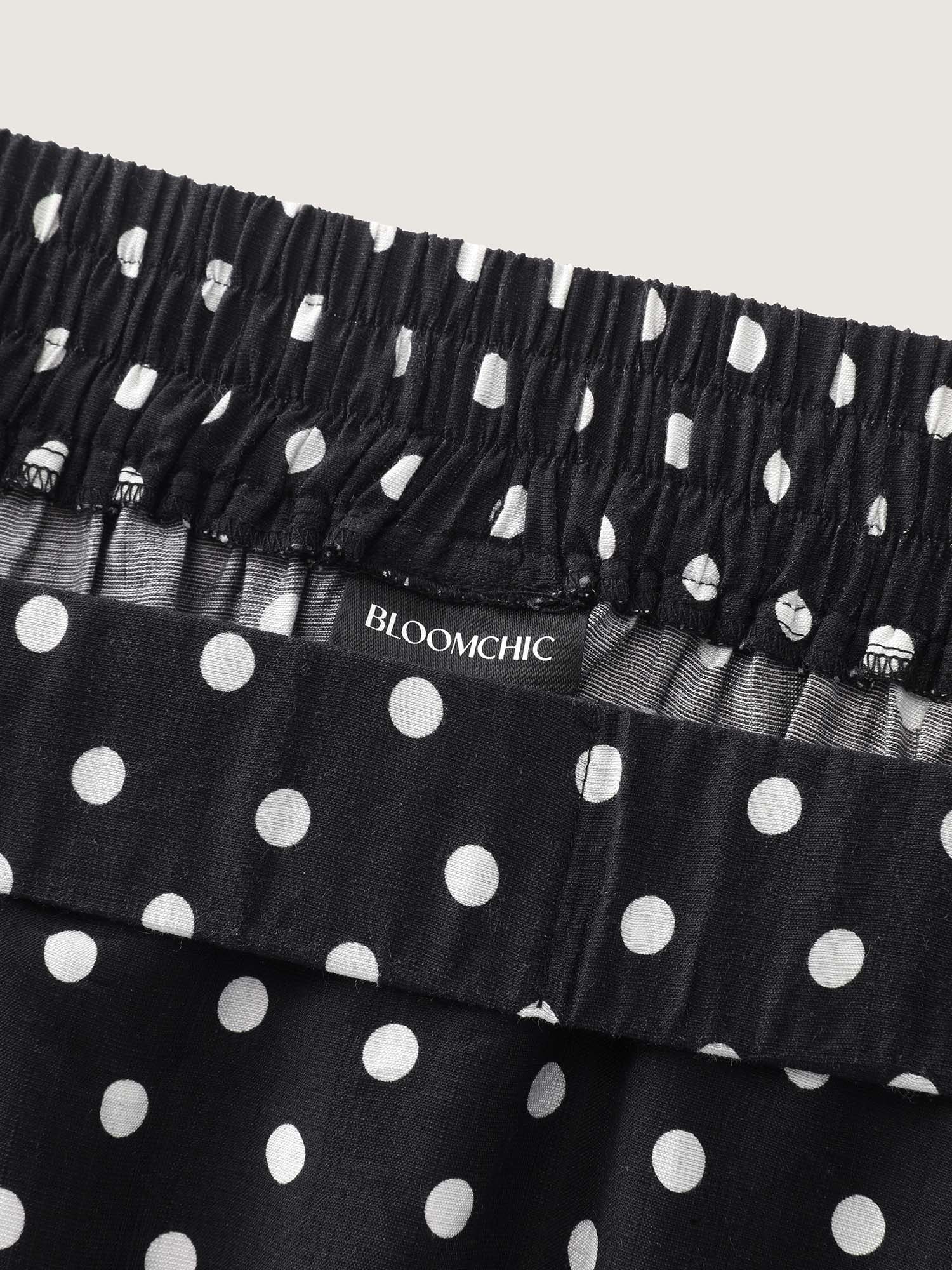 Side view of BloomChic Women's Plus Size Polka Dots Charm Maxi Skirt Black Non Flared Elegant 30/6X