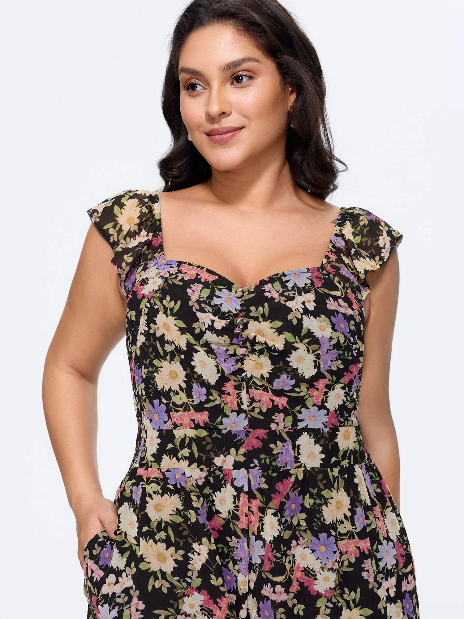 Side view of BloomChic Women's Plus Size Floral Print Shirred Wide-Leg Jumpsuit BlackFlower Elegant Fitted 10/M