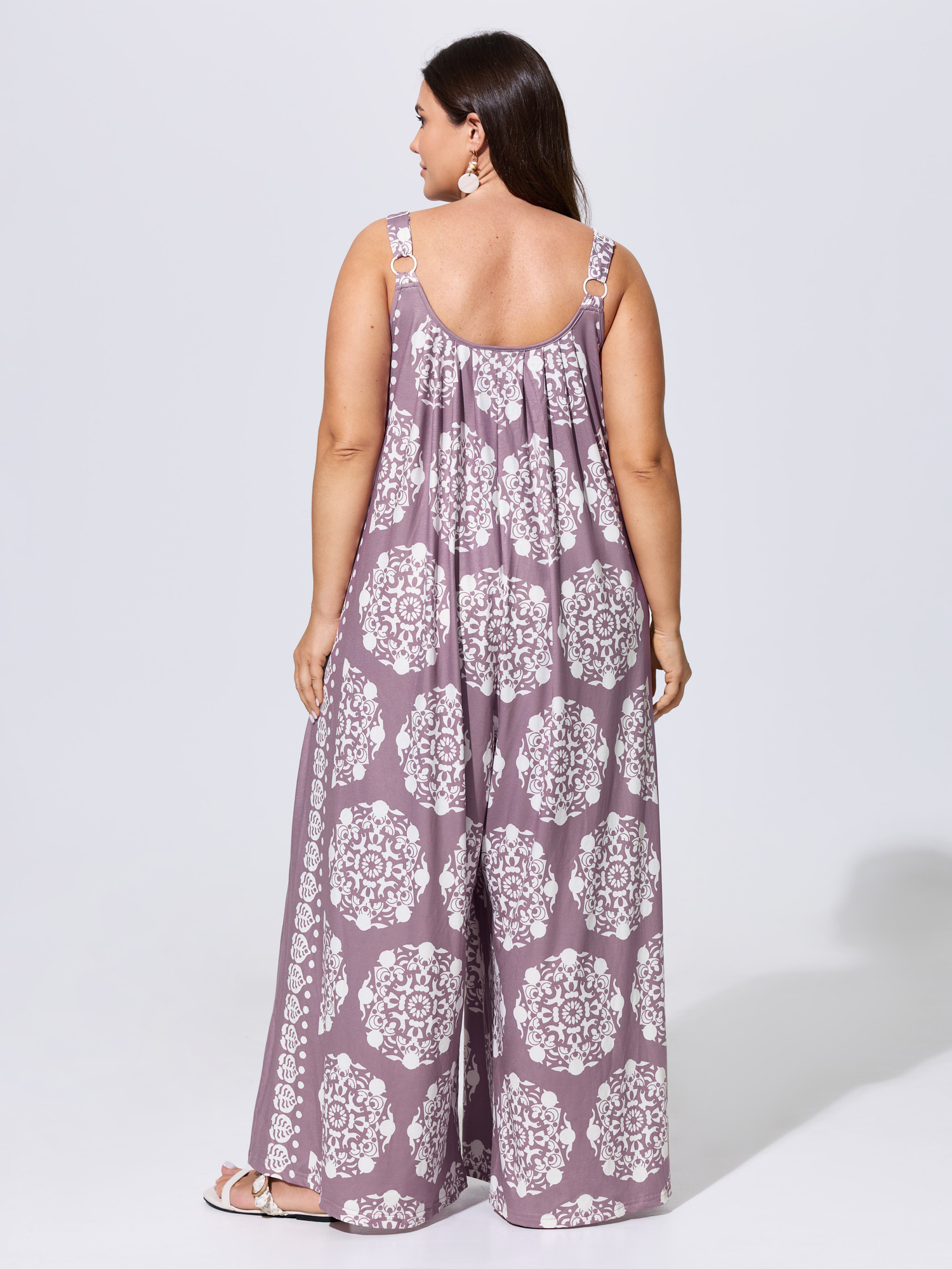 Side view of BloomChic Women's Plus Size Sunkissed Stretchy Adjustable Strap Jumpsuit Lavender Vacation 10/M
