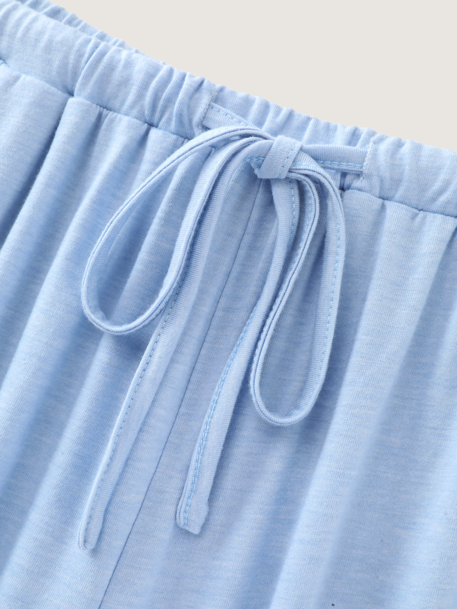 Side view of BloomChic Women's Plus Size Supersoft Drawstring Waist Plain Lounge Bottoms LightBlue 30/6X