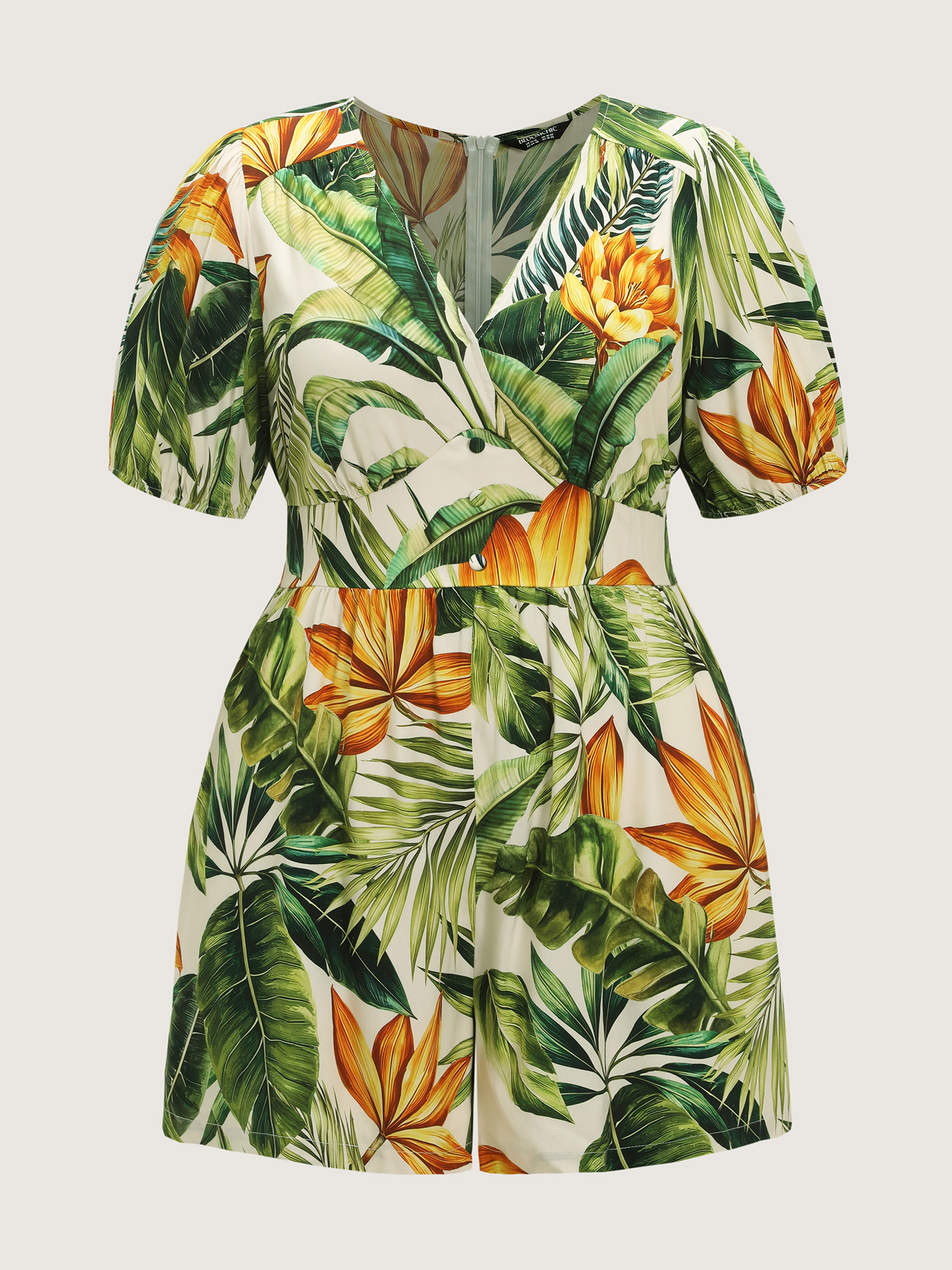 Side view of BloomChic Women's Plus Size Tropical Print Shirred Wide-Leg Romper Truegreen Vacation 26/4X