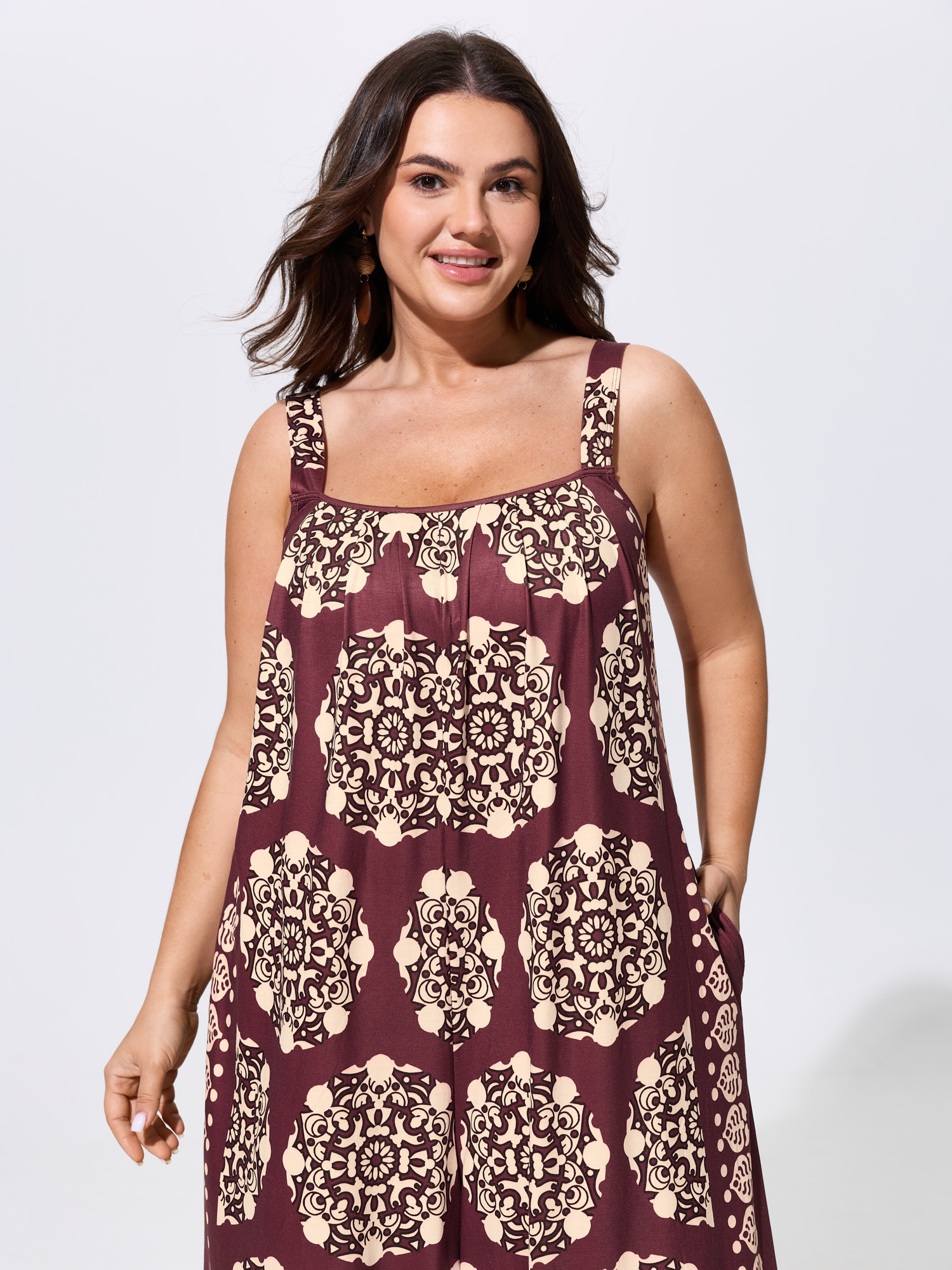 Side view of BloomChic Women's Plus Size Sunkissed Stretchy Adjustable Strap Jumpsuit Plum Vacation 28/5X