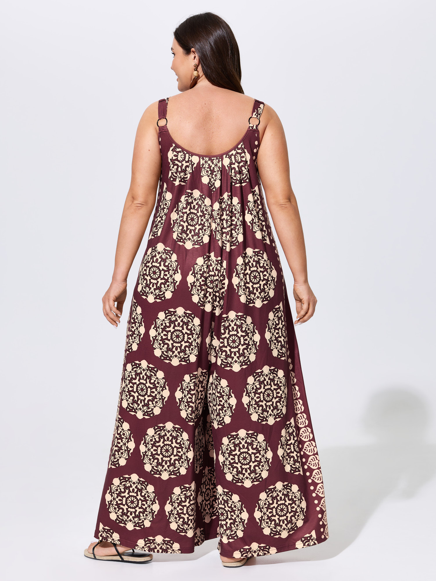 Side view of BloomChic Women's Plus Size Sunkissed Stretchy Adjustable Strap Jumpsuit Plum Vacation 28/5X