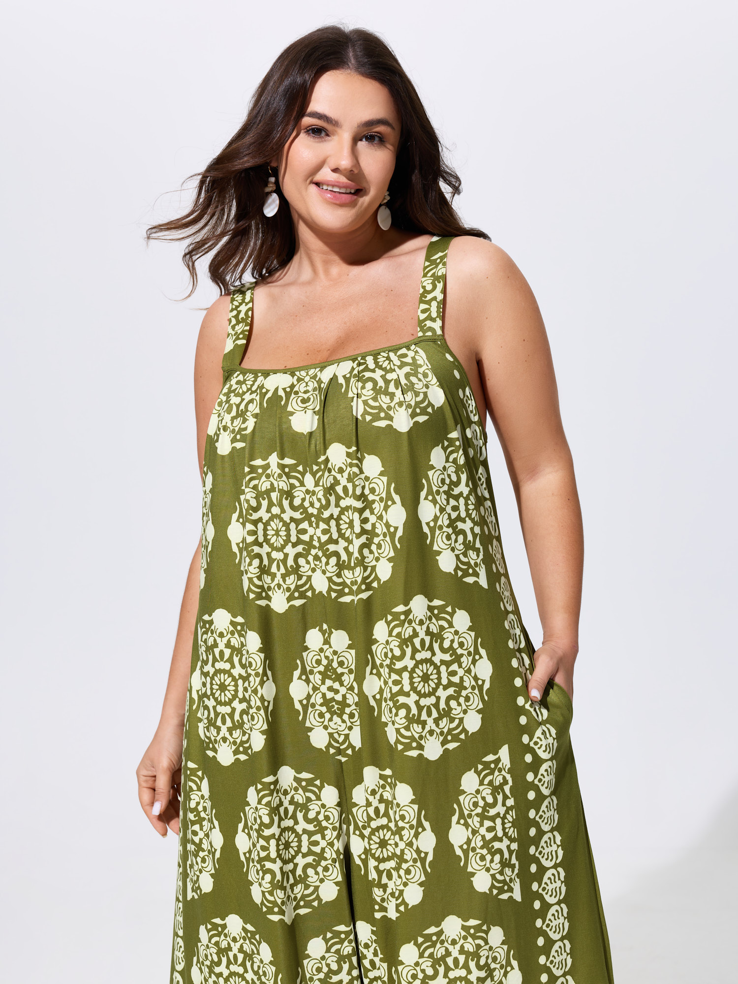 Side view of BloomChic Women's Plus Size Sunkissed Stretchy Adjustable Strap Jumpsuit Olive Vacation 10/M
