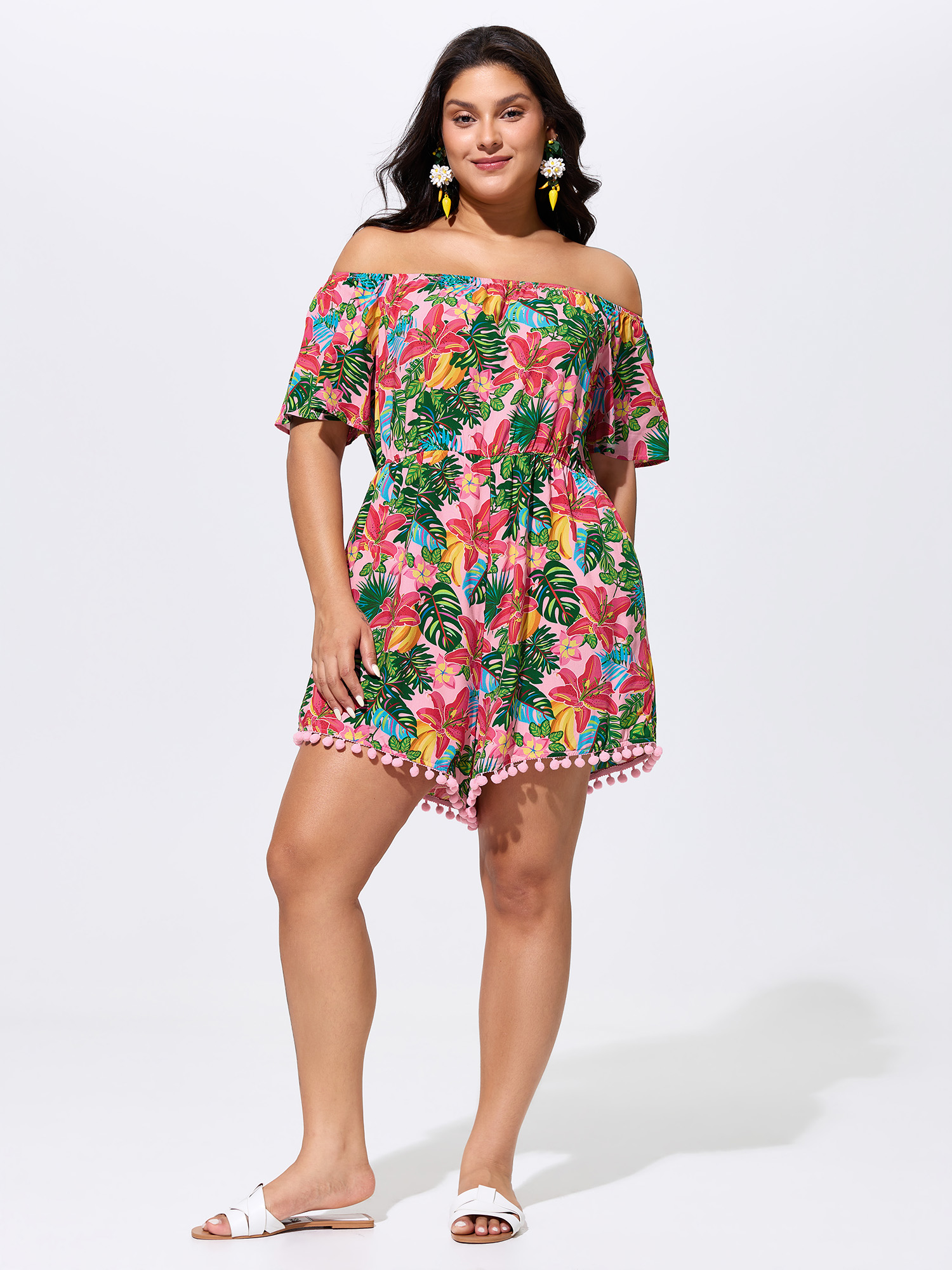Side view of BloomChic Women's Plus Size Vibrant Floral Print Off-Shoulder Romper Blush Vacation 12/L